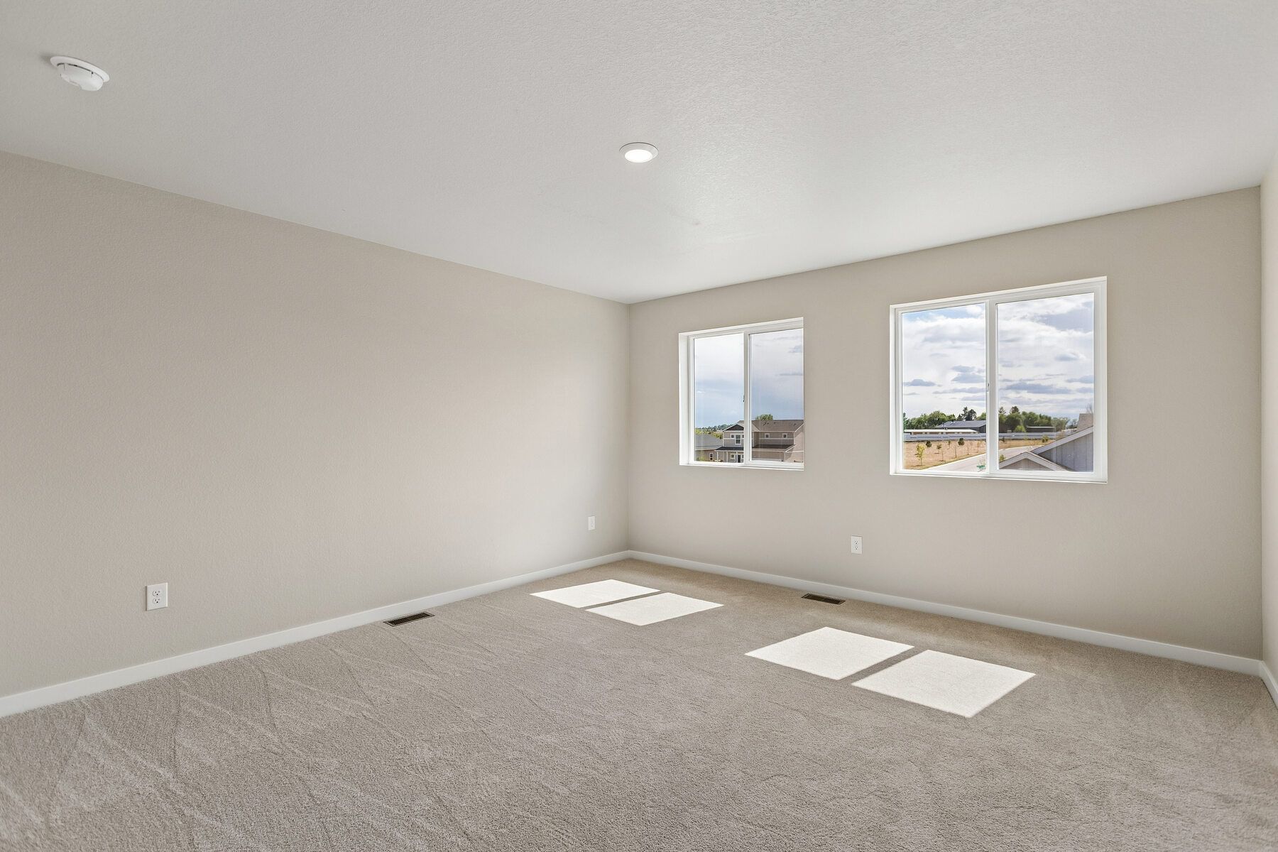 The master bedroom is spacious with large windows!