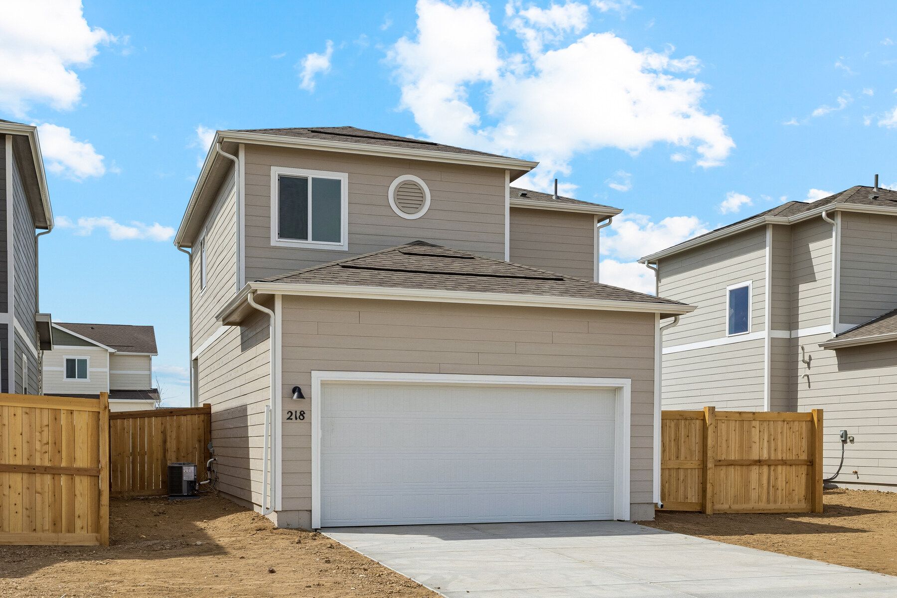 The garage is in the back of the home.