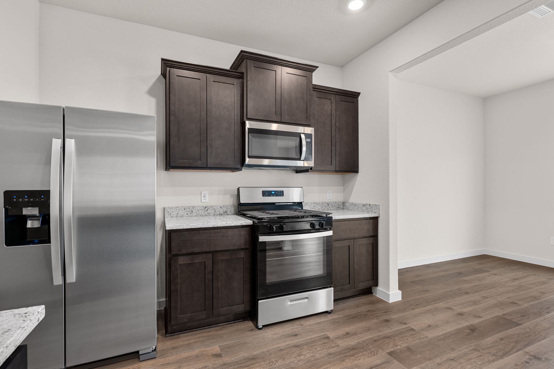 The kitchen has sprawling granite countertops.