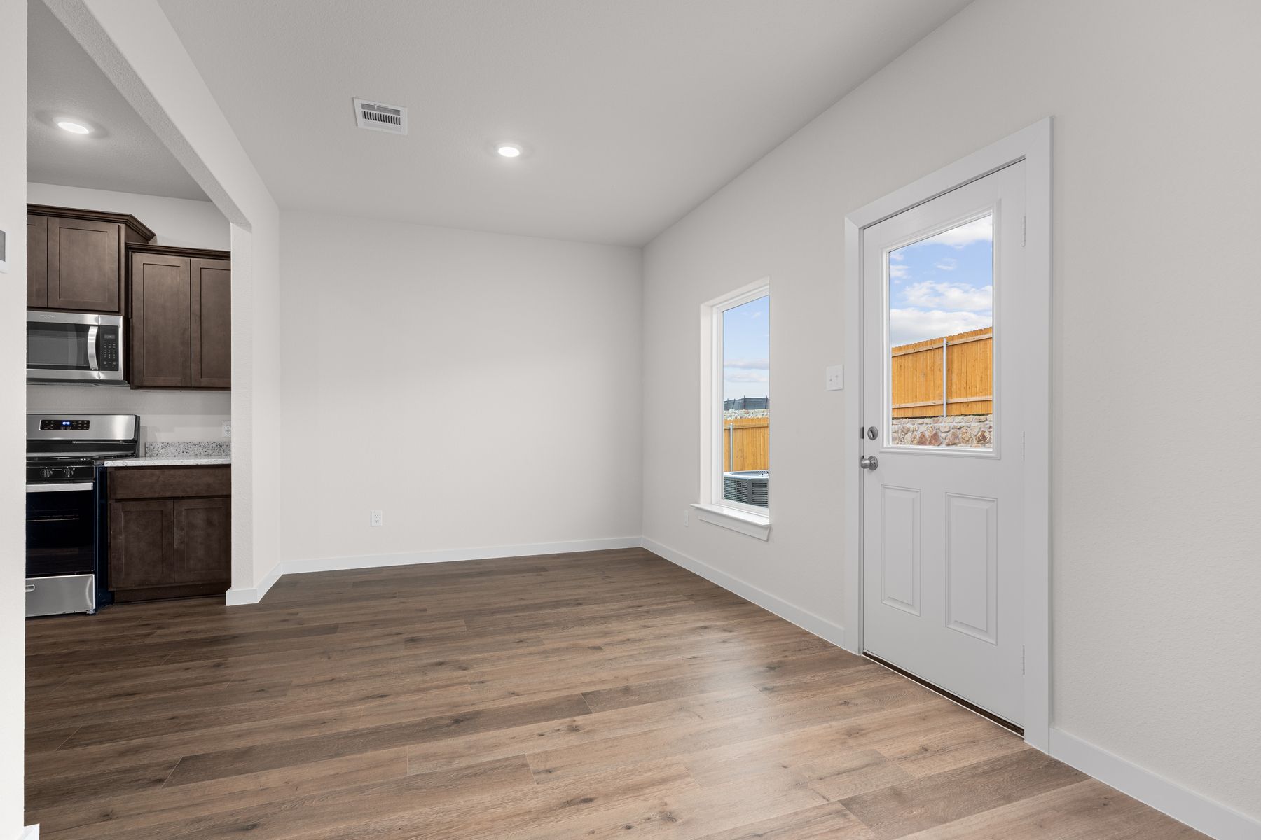 The dining room has a large window that lets in great, natural light.