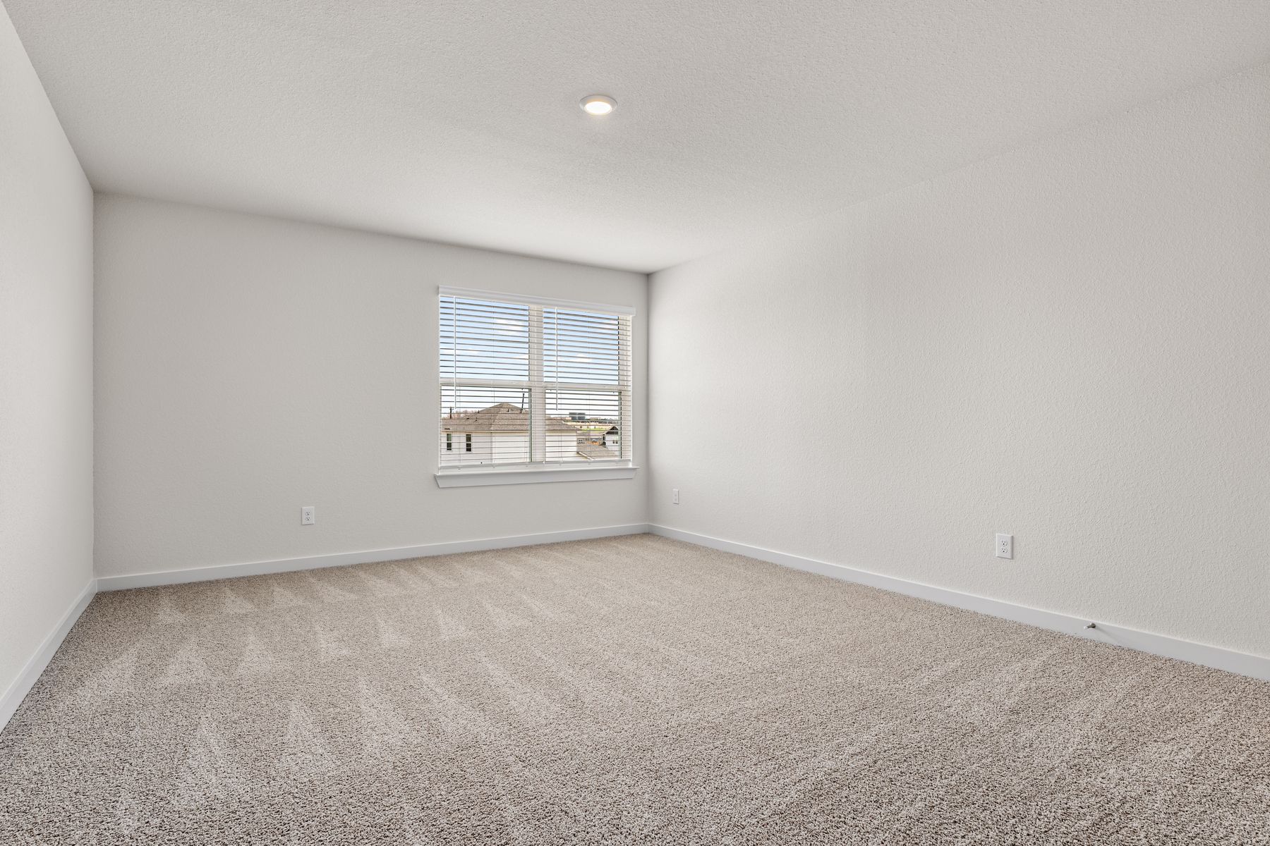 The master bedroom has a large window that lets in great, natural light.