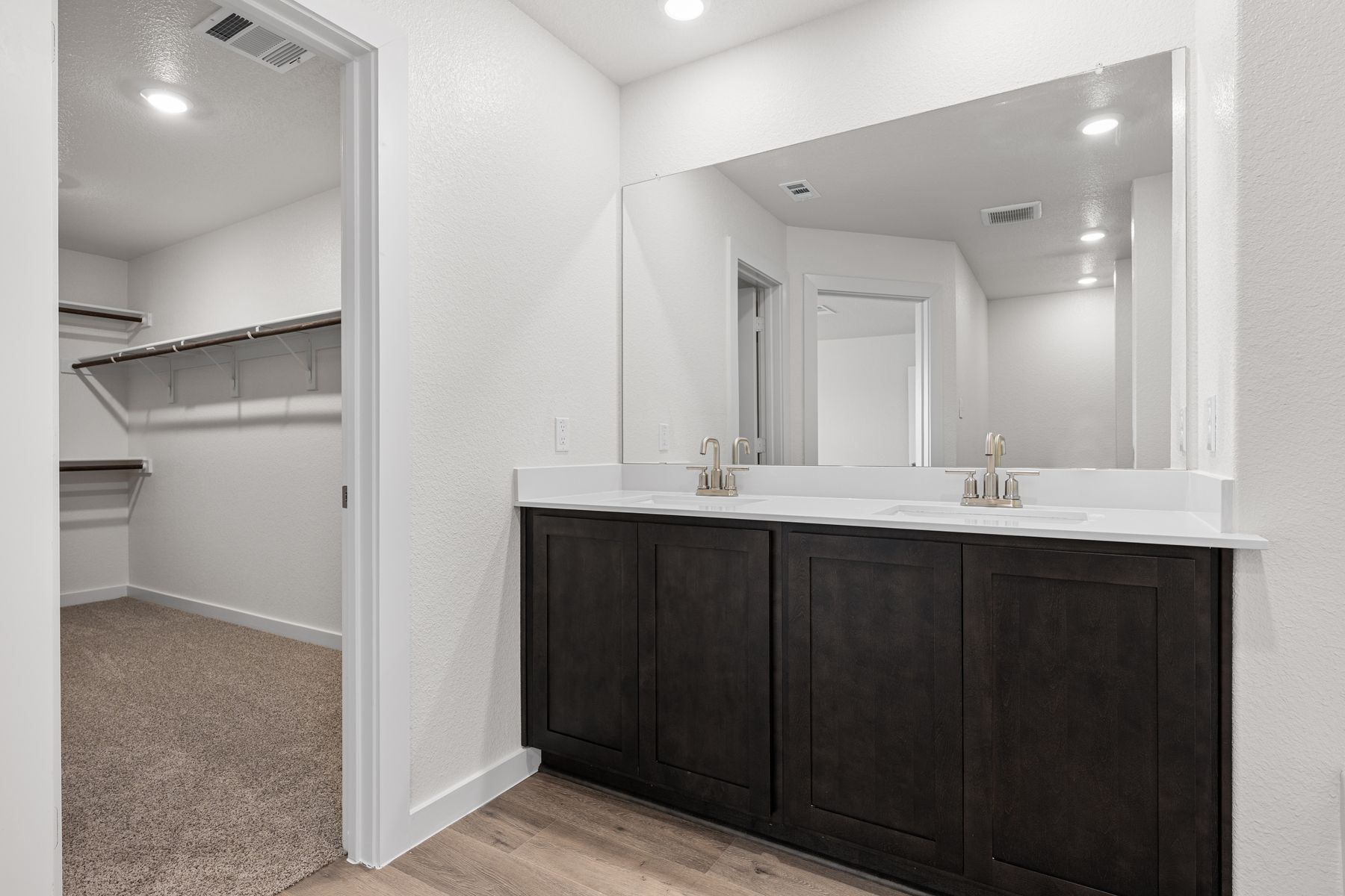 The master bathroom has a sprawling dual-sink vanity.