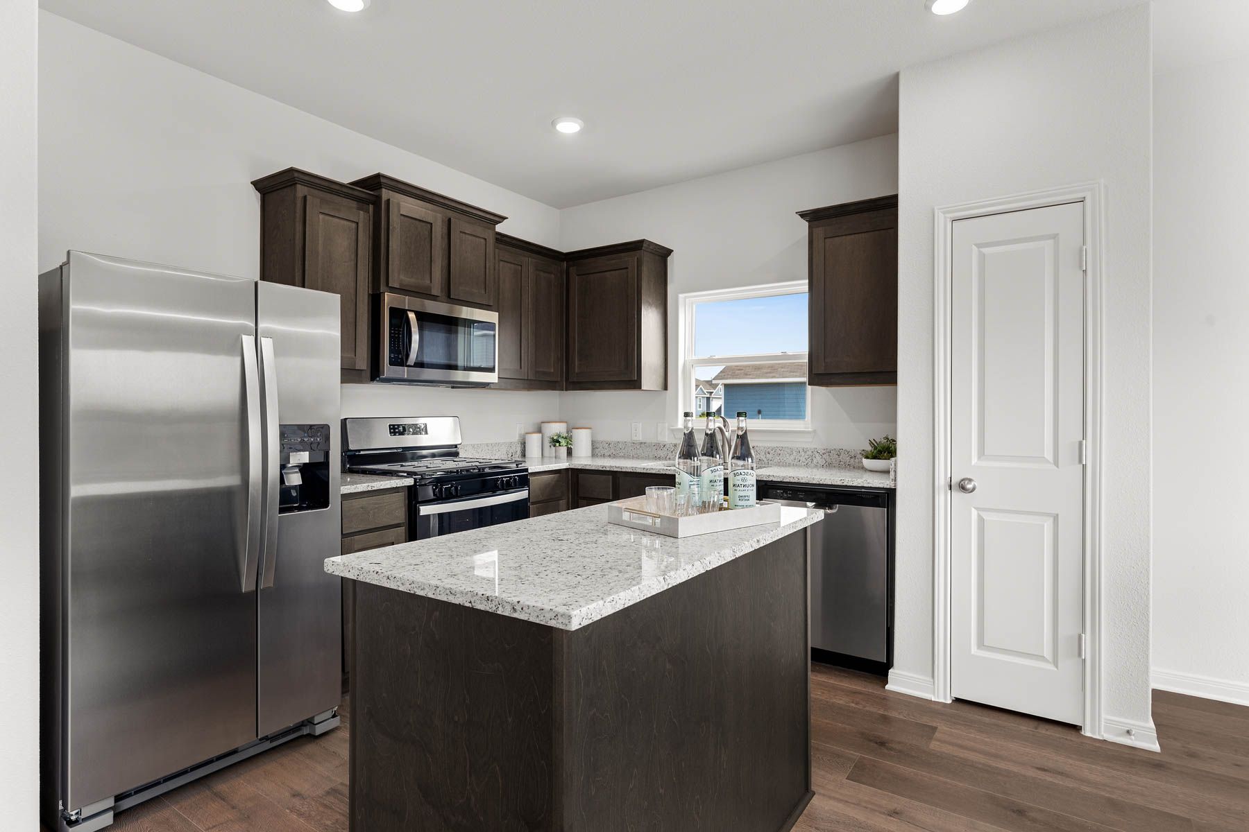 The kitchen has sprawling granite countertops.