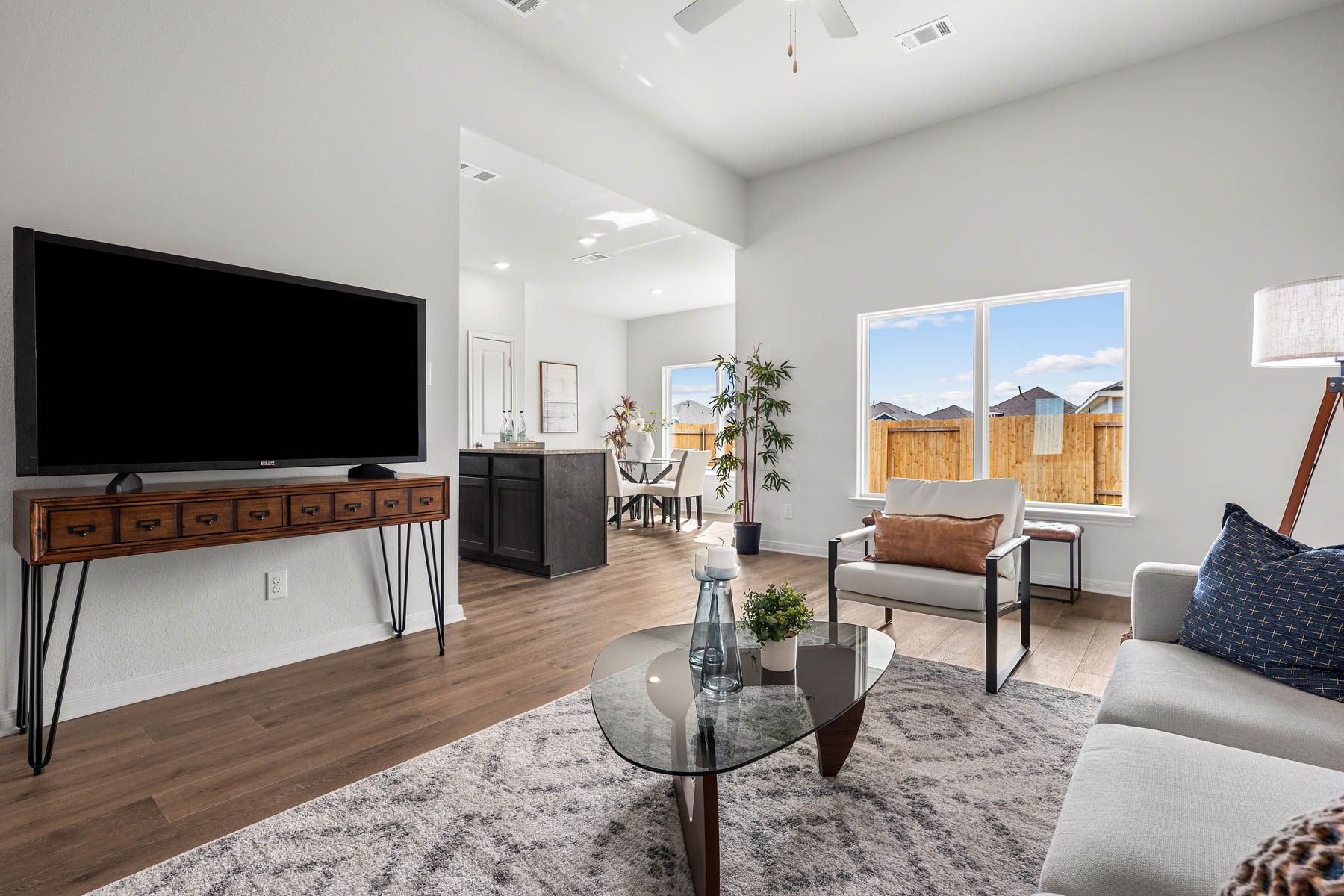 The living room has windows that let in great, natural light.
