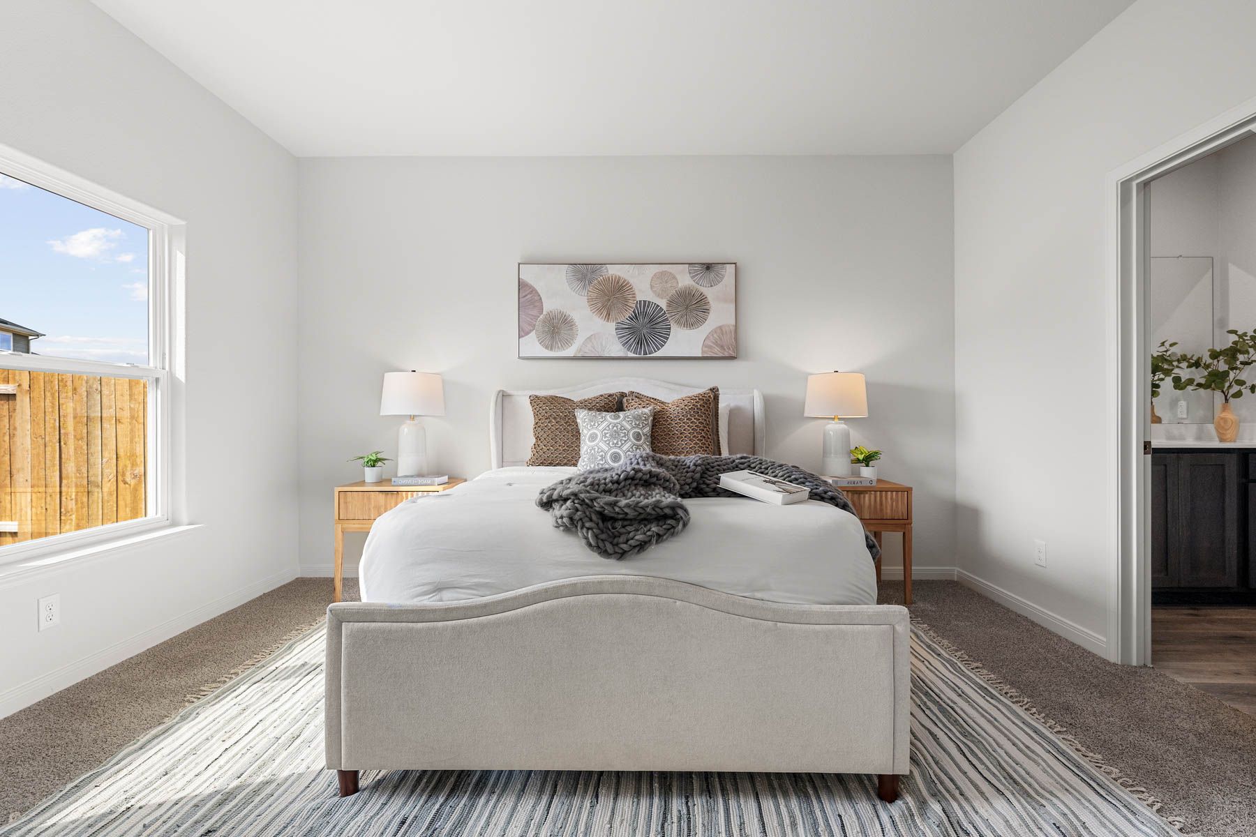 The master bedroom has a large window that lets in great, natural light.