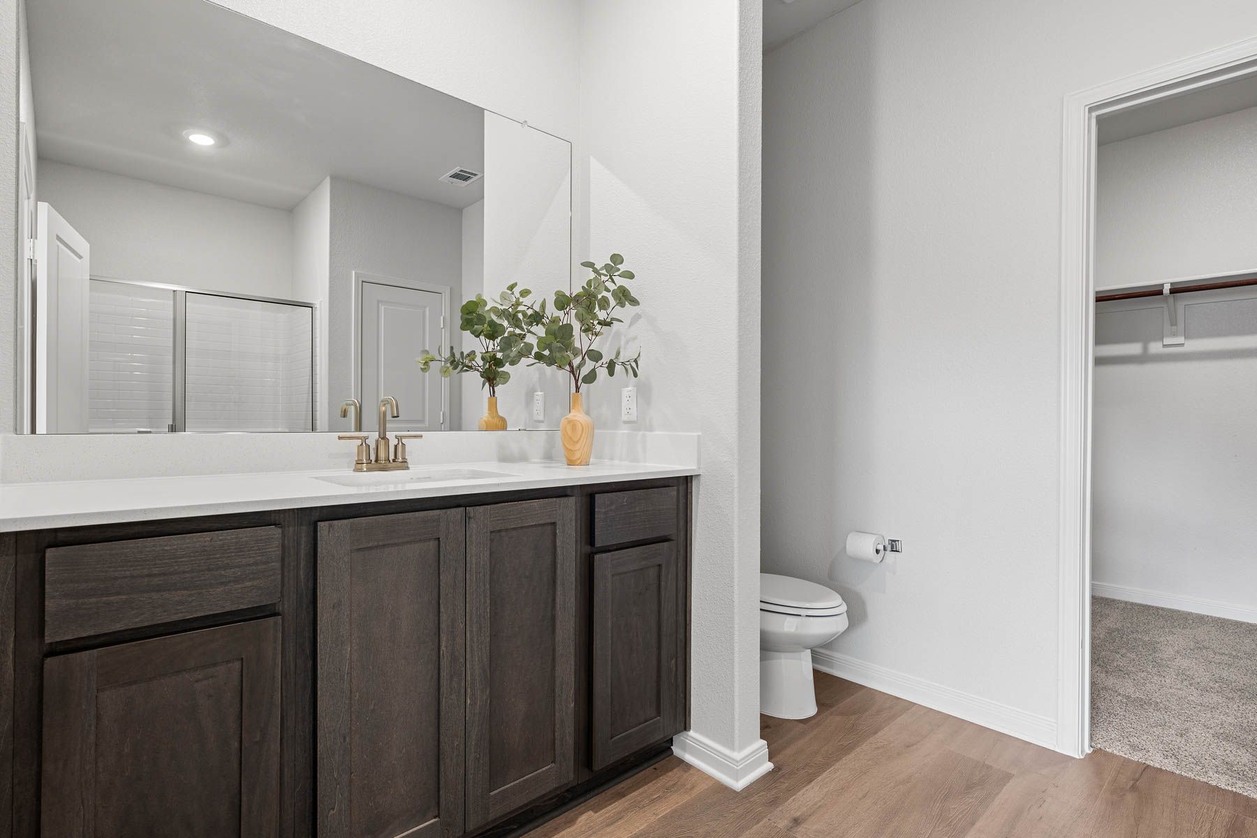 The master bathroom has a sprawling vanity.
