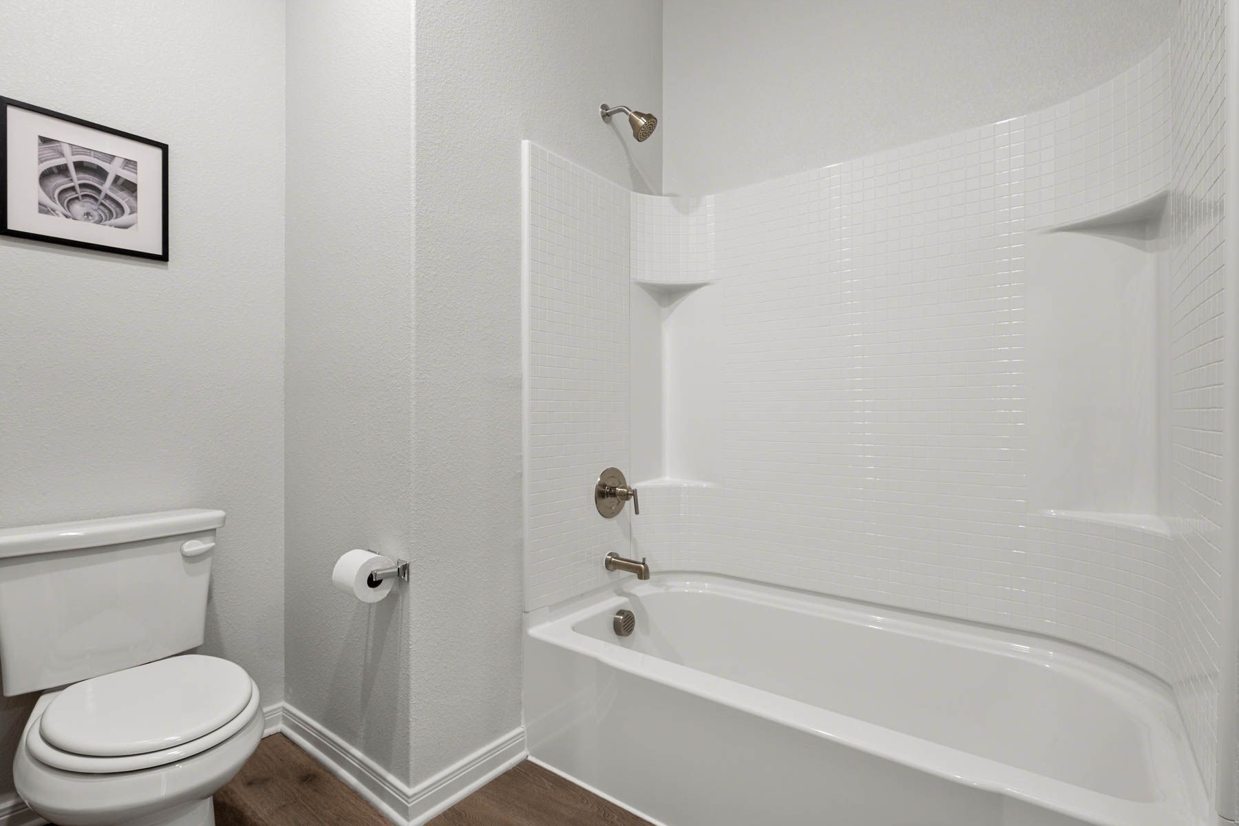 The secondary bathroom has a shower tub combo.