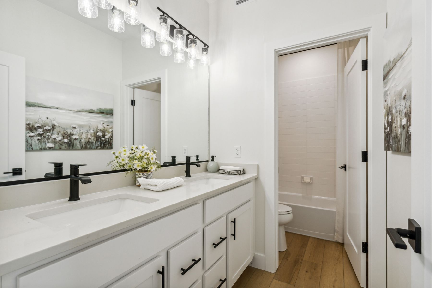 The secondary bathroom has a sprawling dual-sink vanity. 