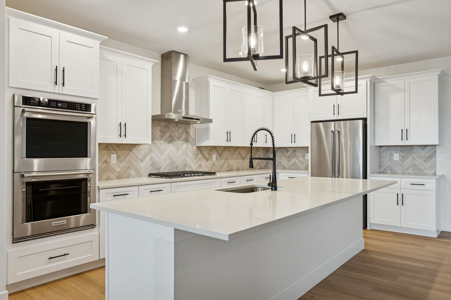 The kitchen has beautiful tile backsplash. 
