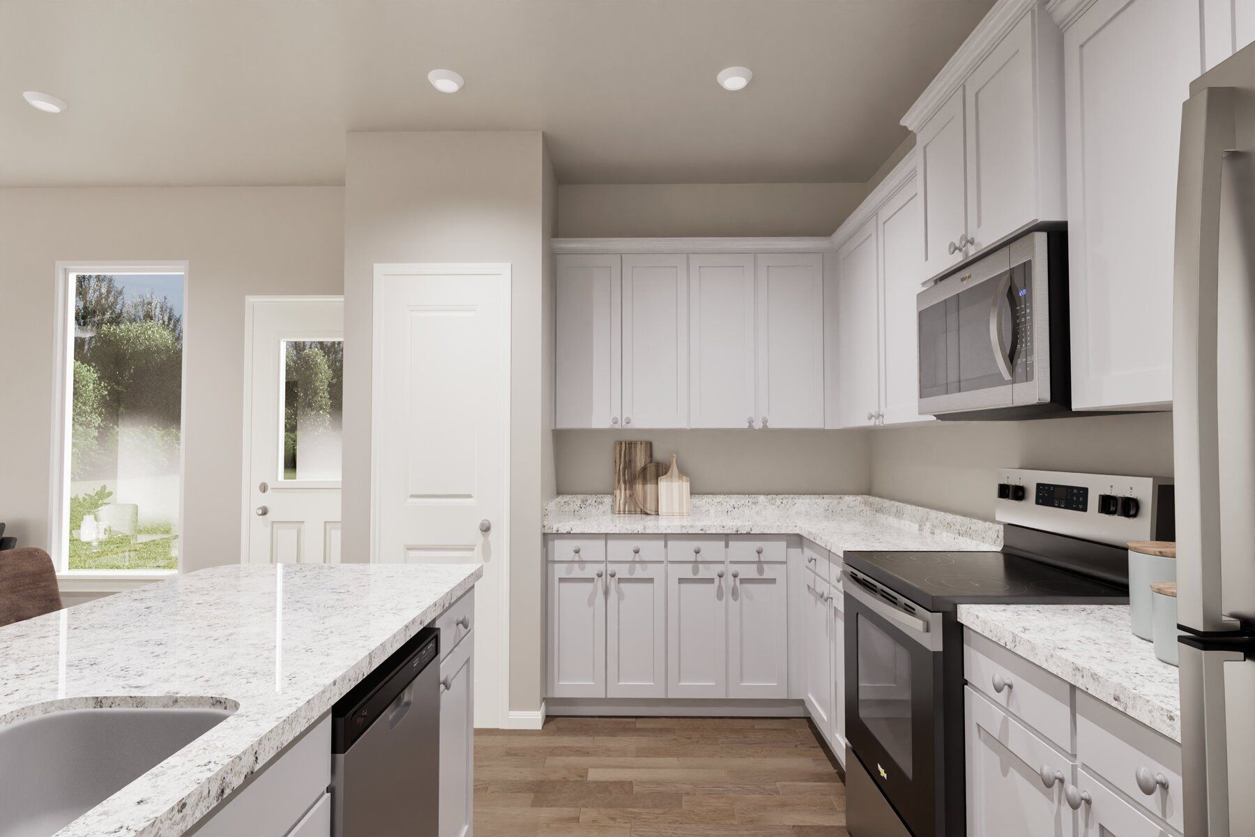 The kitchen features plenty of cabinetry and counterspace.