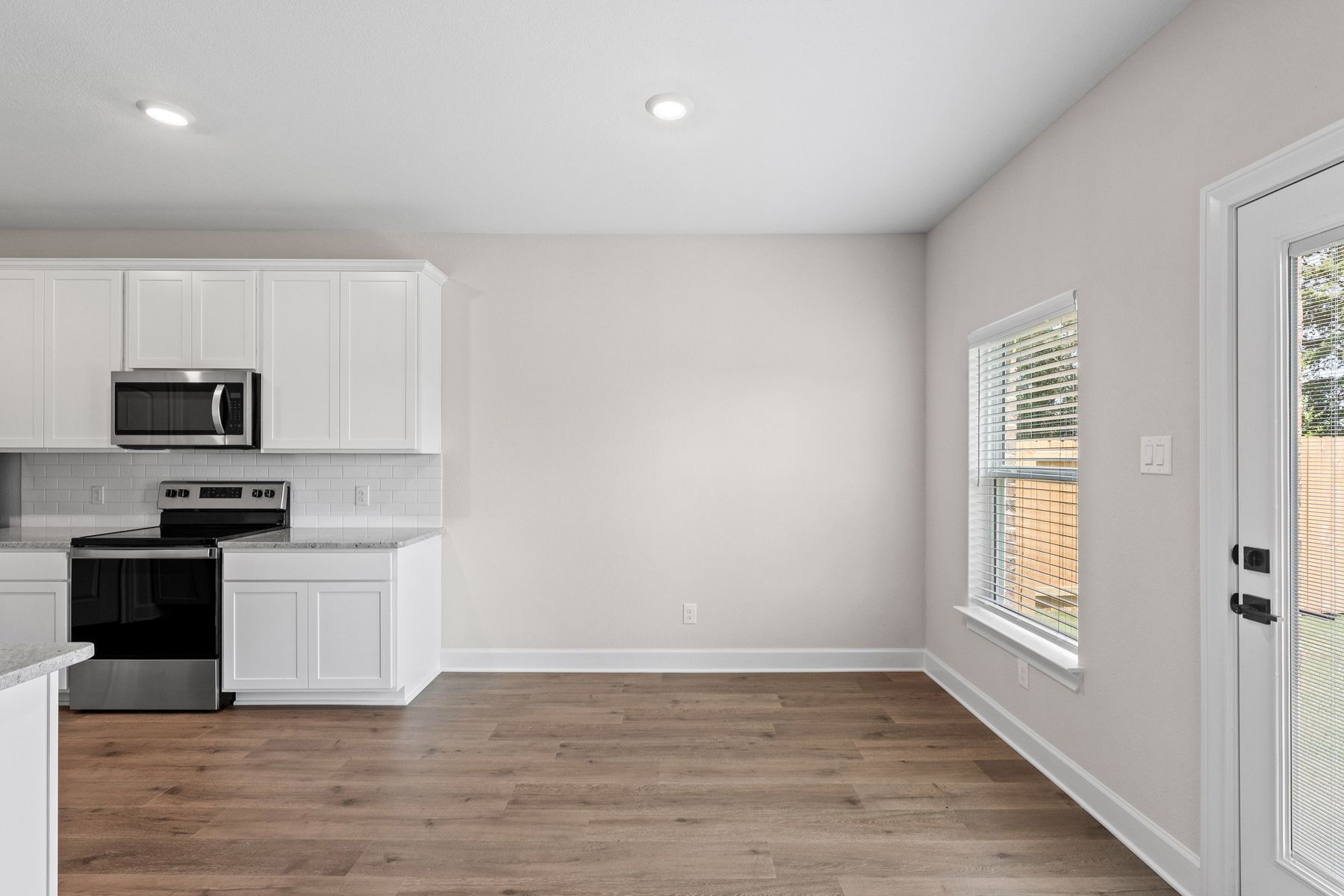 The dining room sits right off of the kitchen.