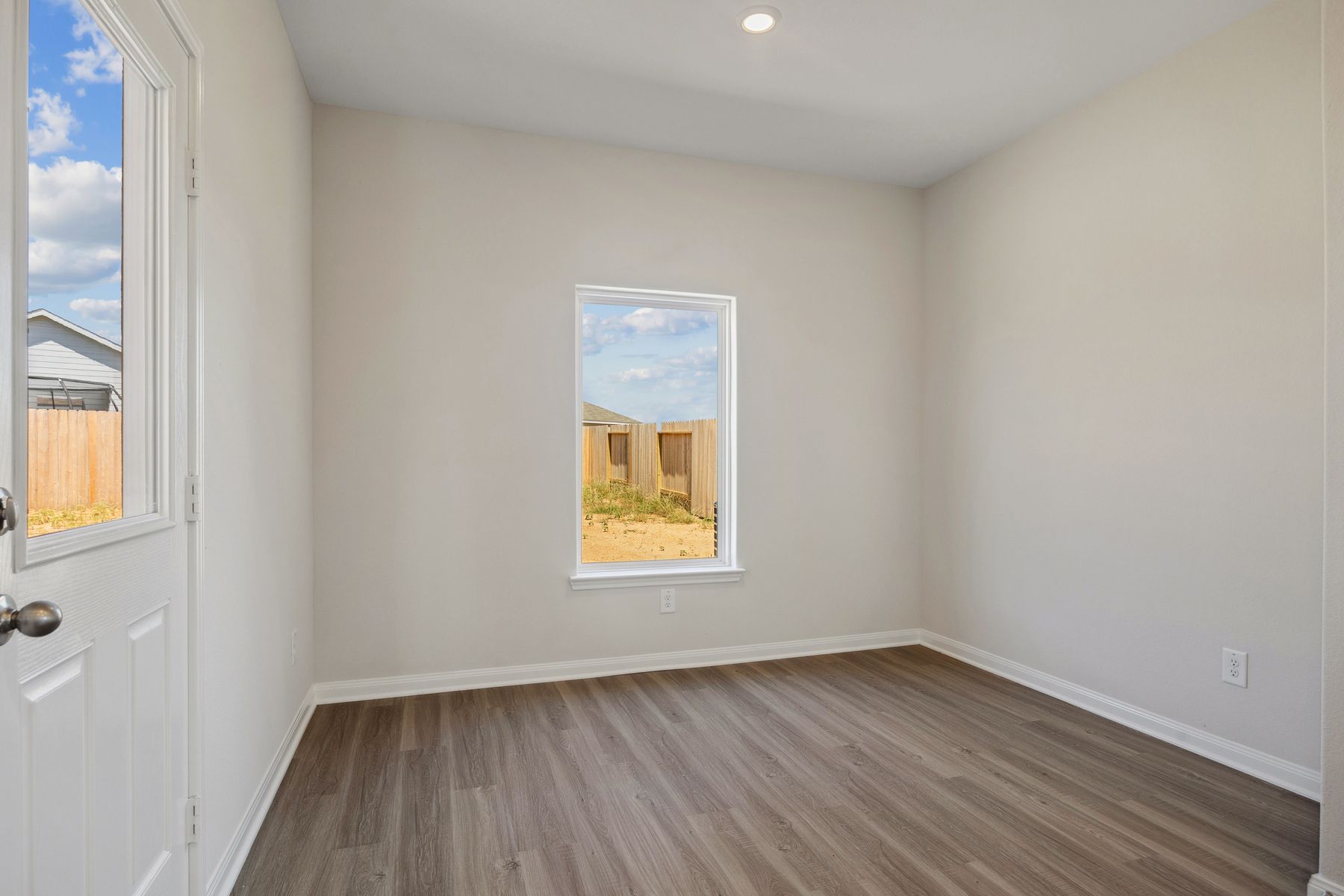 The dining room has a large window that lets in great, natural light. 