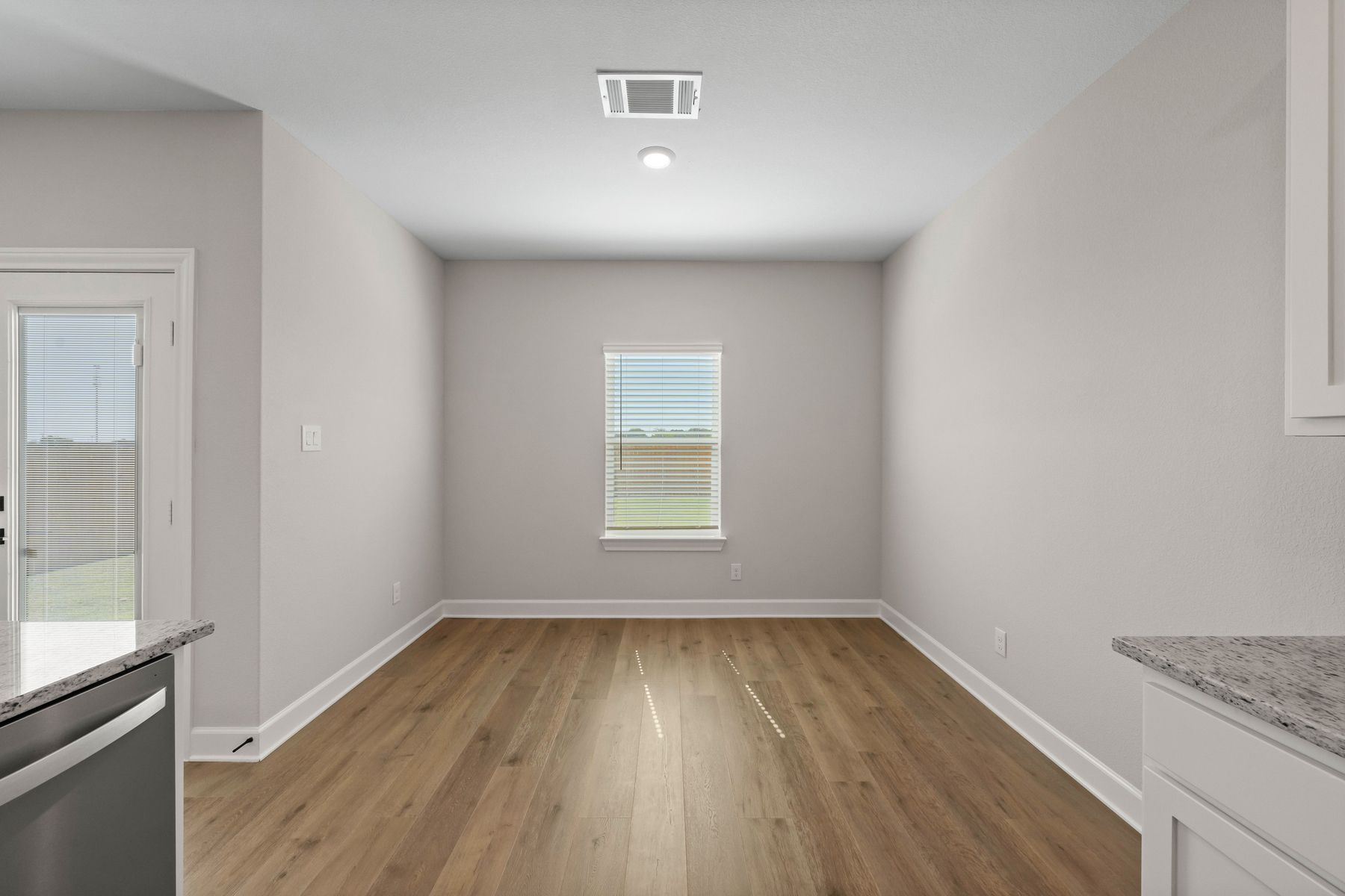 The dining room has a large window that lets in great, natural light.