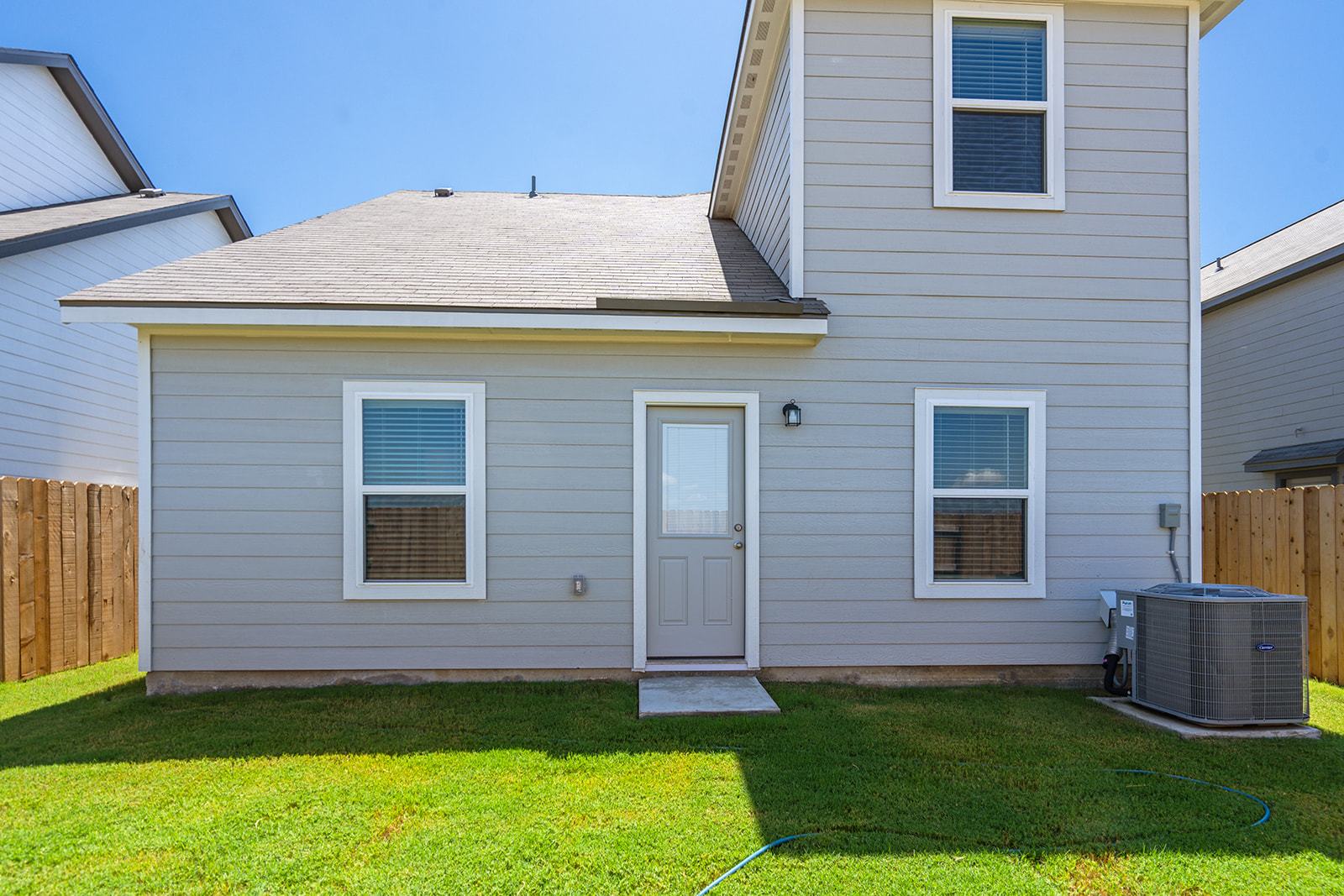 A generously sized backyard ready for outdoor enjoyment.