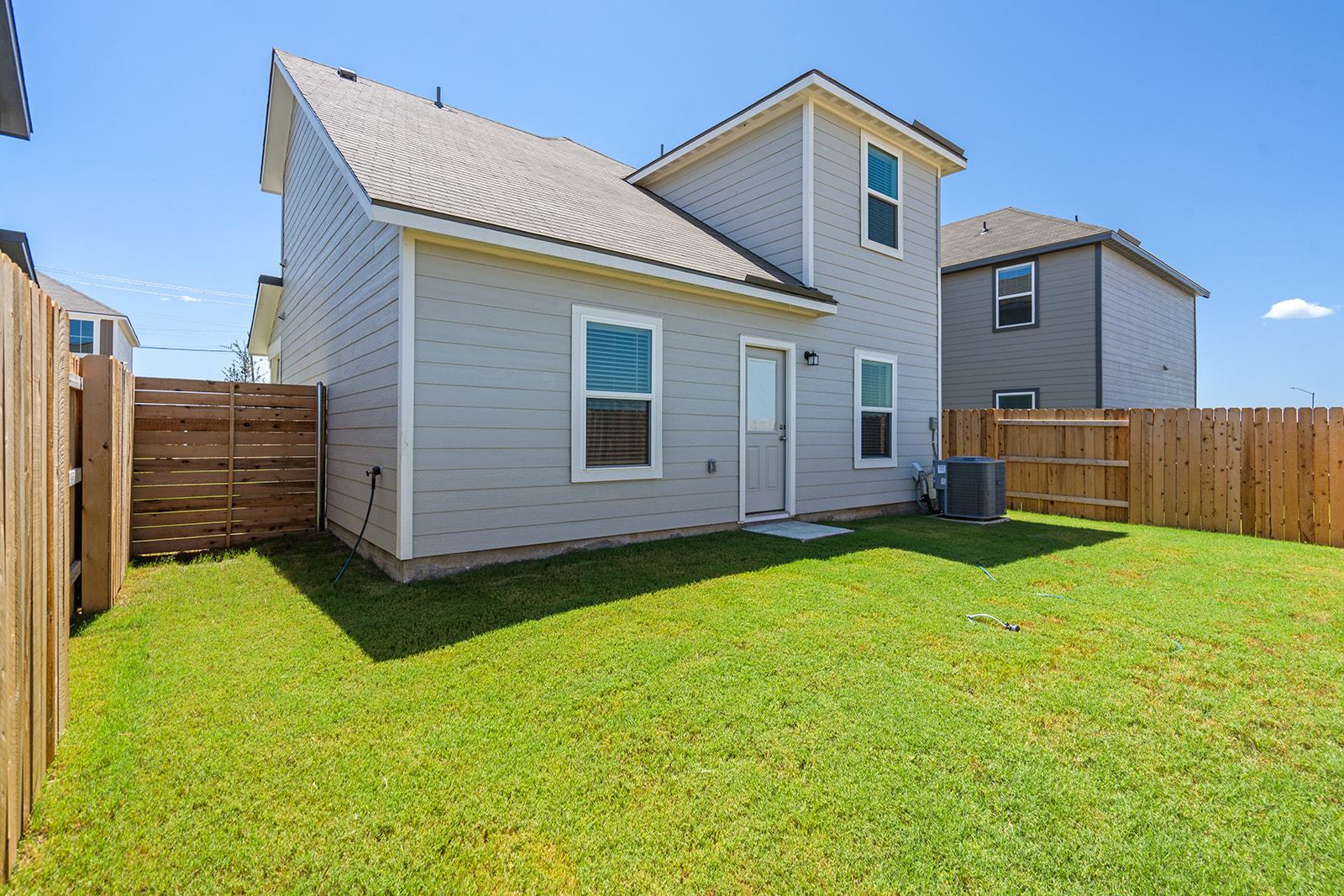 A generously sized backyard ready for outdoor enjoyment.
