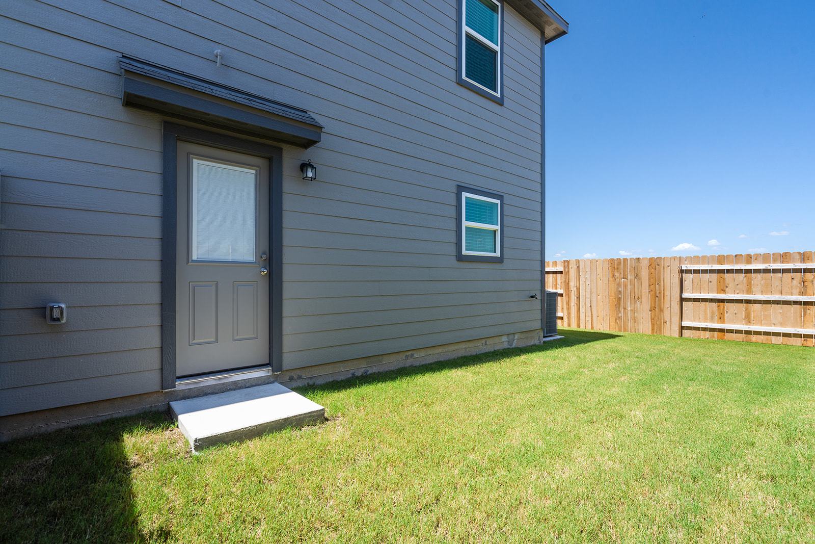 A generously sized backyard ready for outdoor enjoyment.