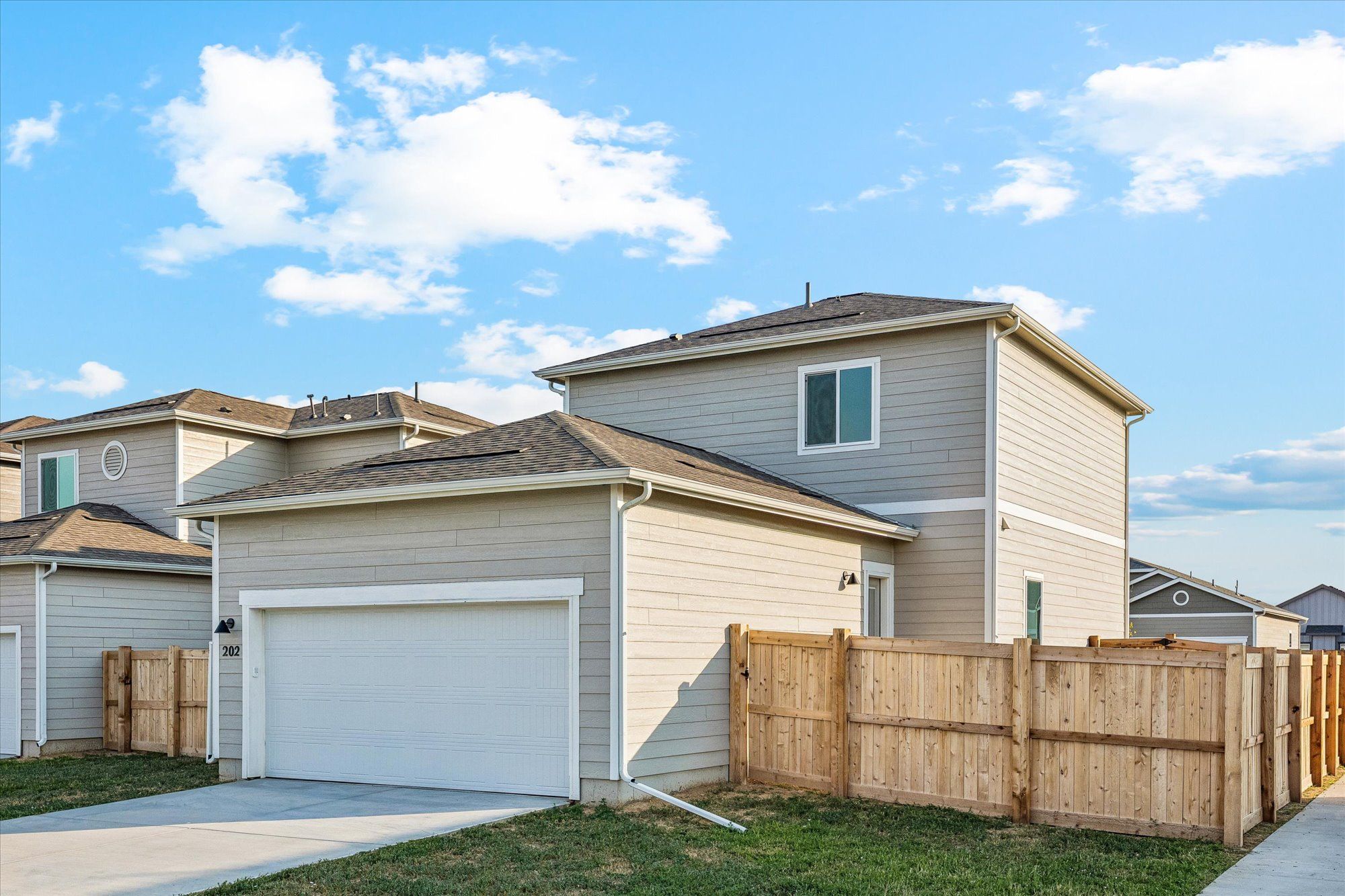The garage is conveniently located in the back of the home.