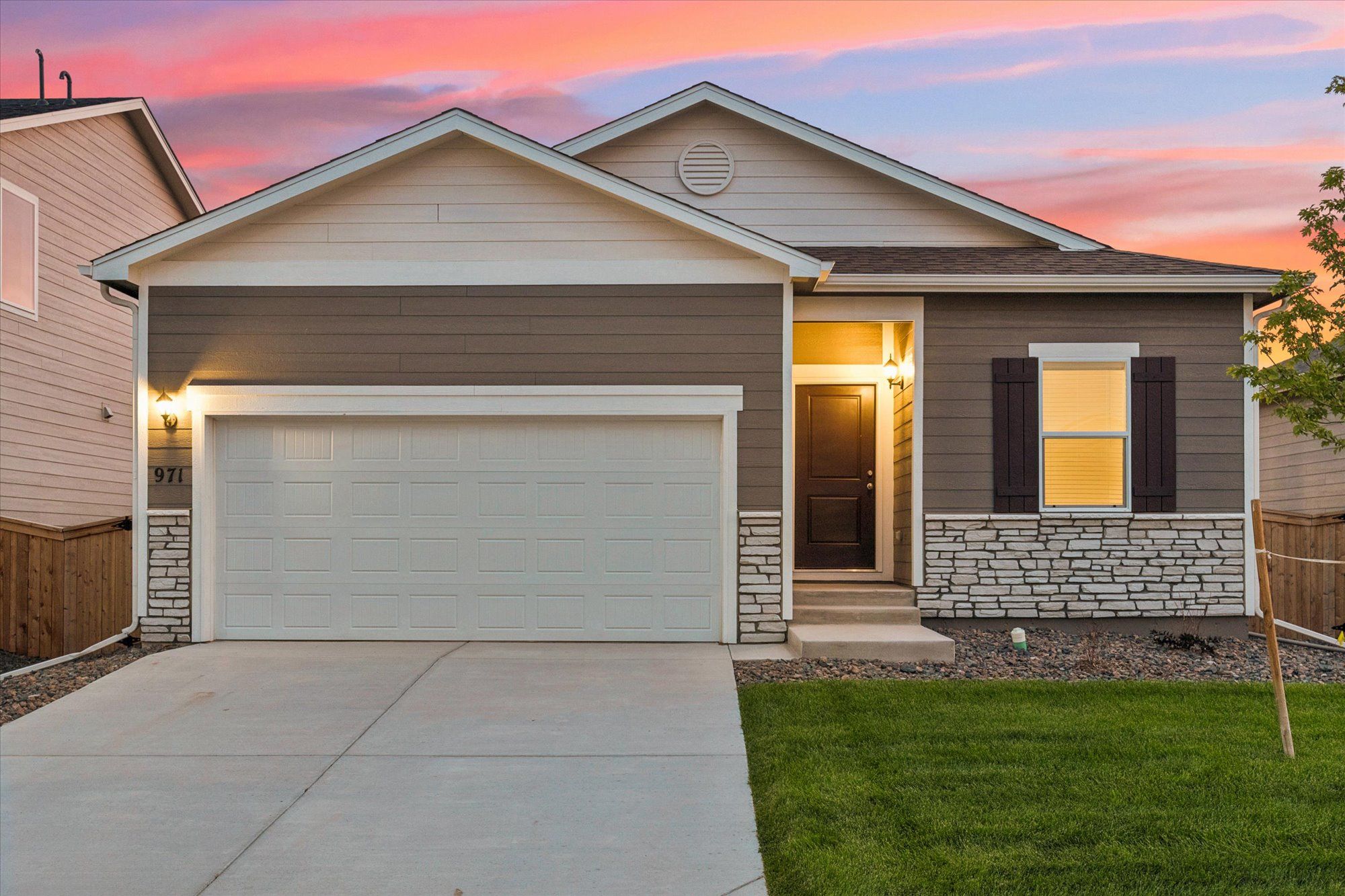 The Arapaho plan features a two car garage