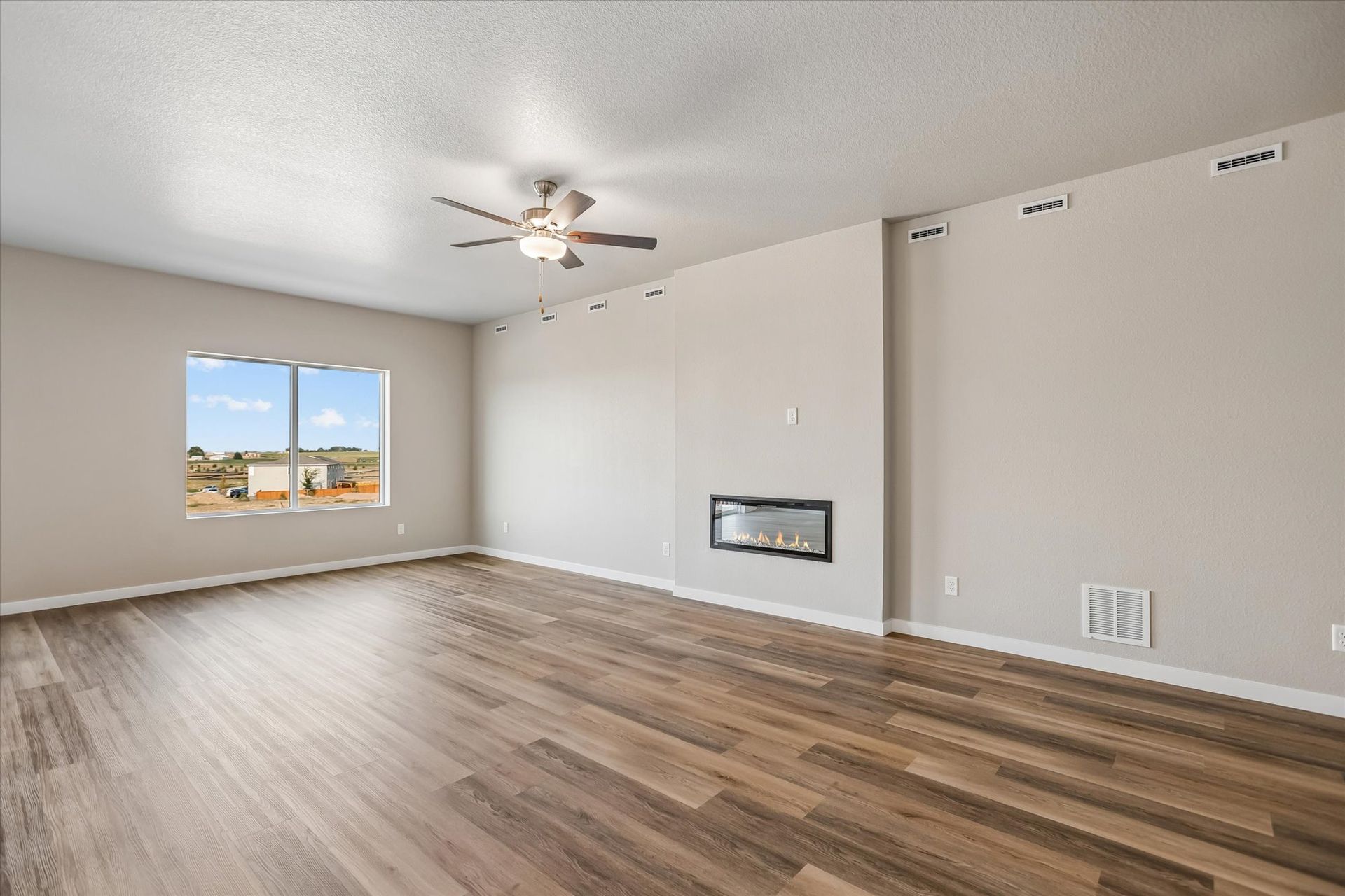 The family room features an electric fireplace.
