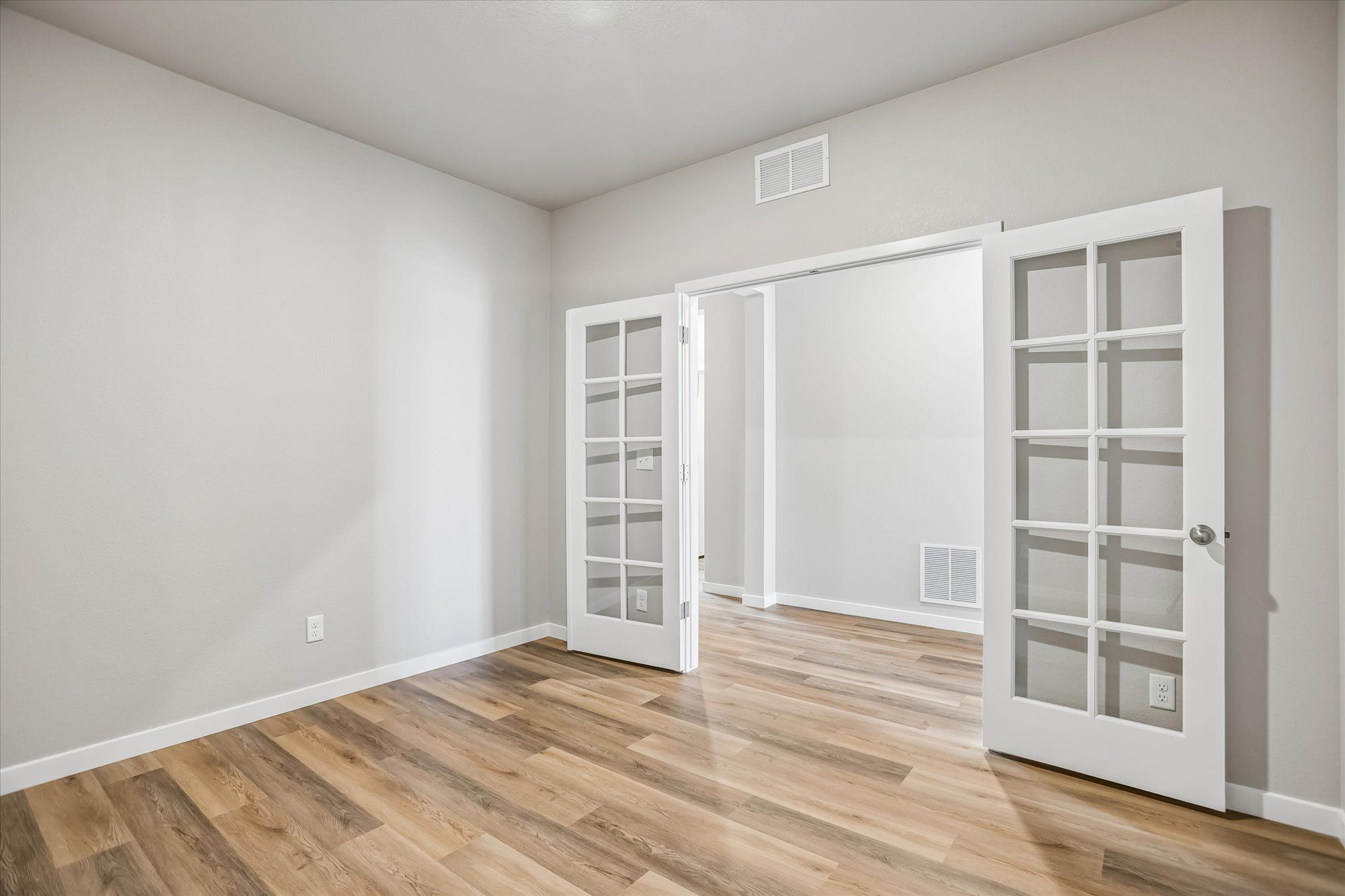 The Pike includes a flex room right off the foyer, it would be great for a home office.