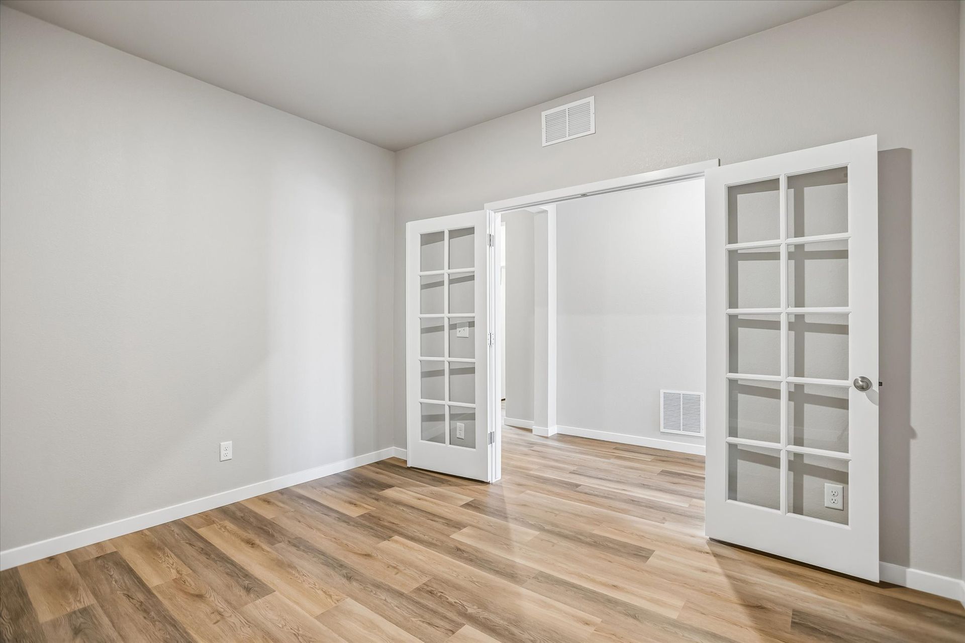 The Pike includes a flex room right off the foyer, it would be great for a home office.