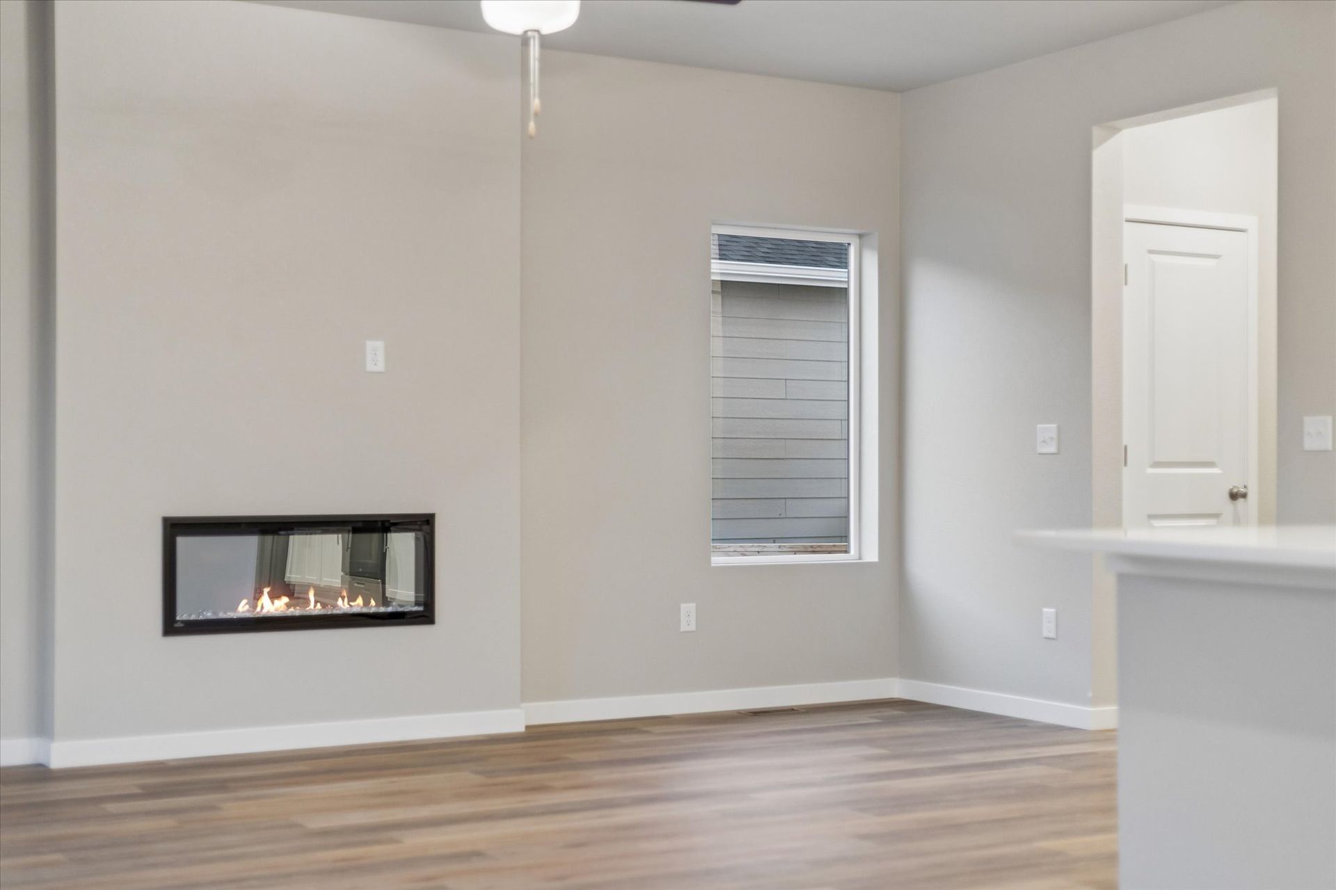 The family room has an electric fireplace.