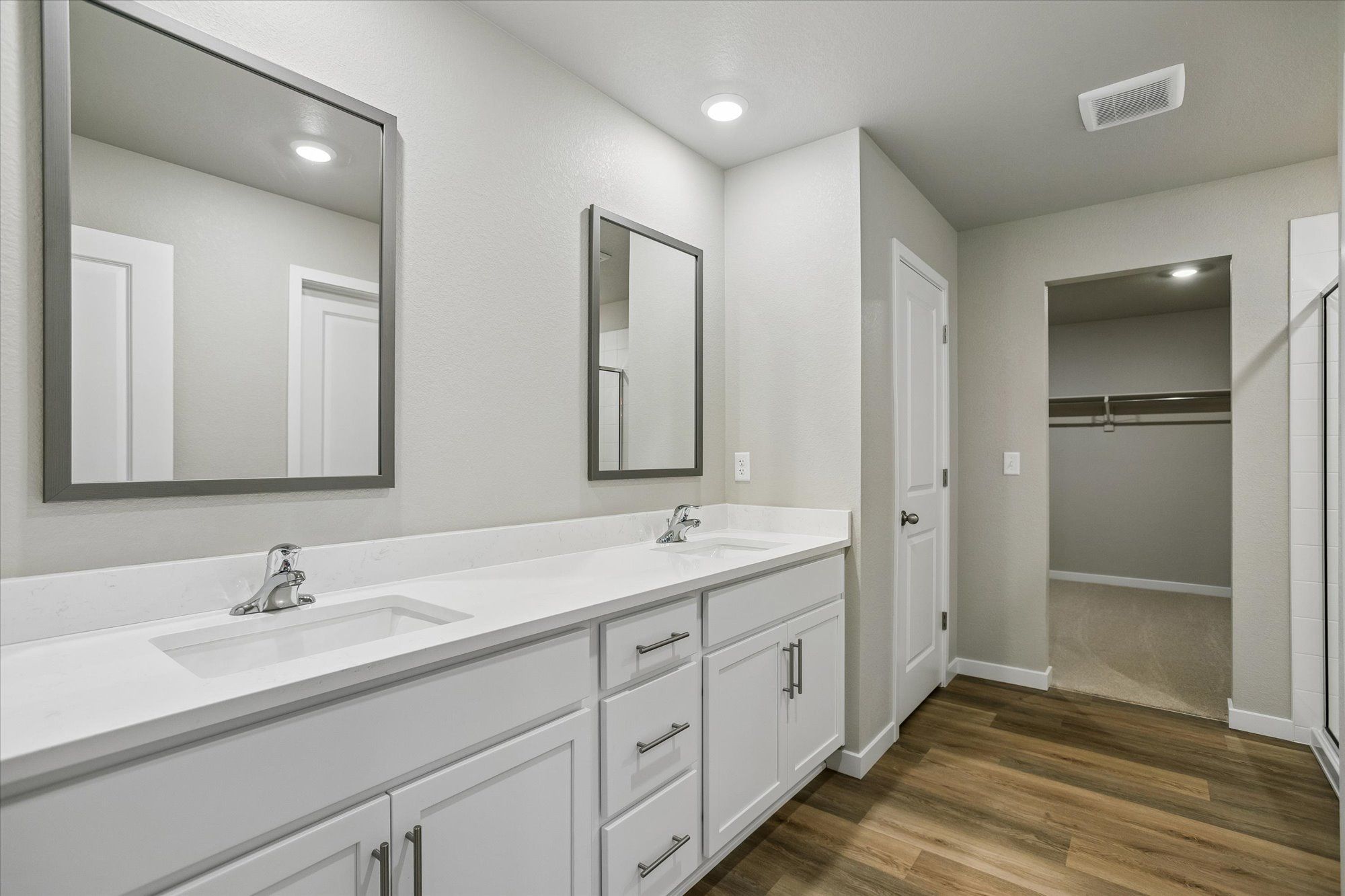Within the primary suite, there are dual sinks in the ensuite. 