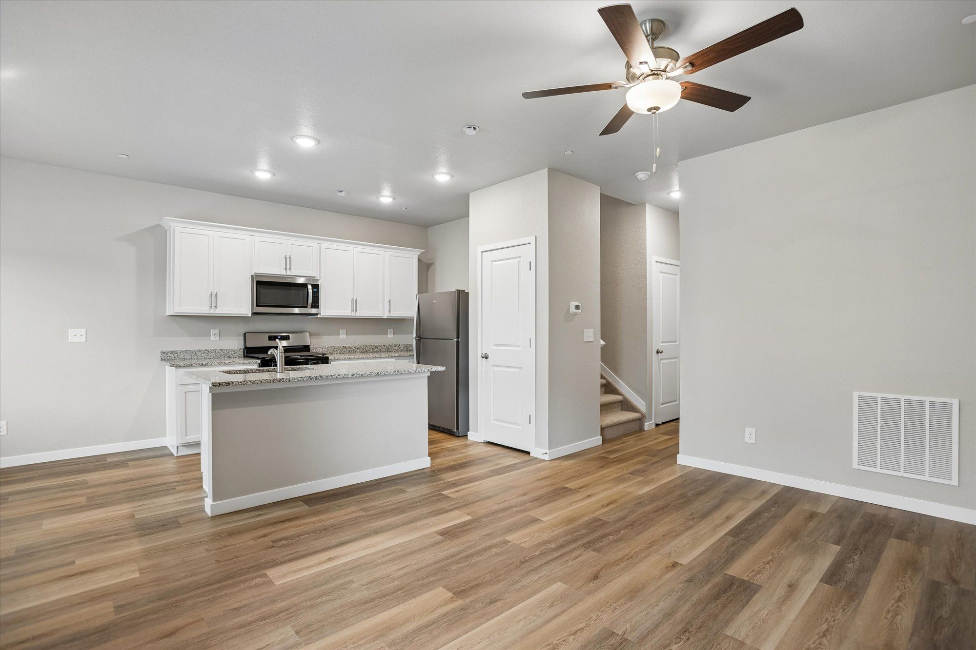 The kitchen opens to the dining and family room.