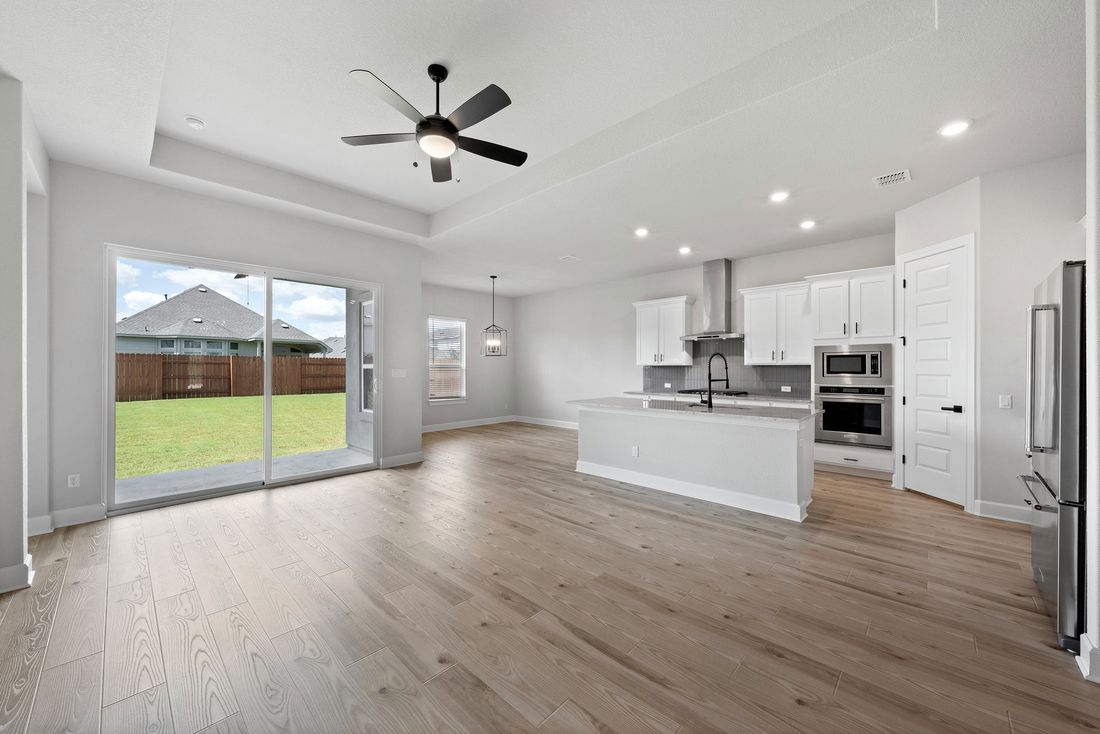 Open floor plans connect the living room and gorgeous kitchen