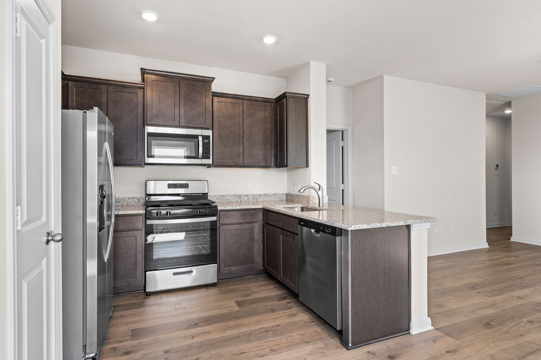 The beautiful kitchen has wonderful upgrades like granite countertops.