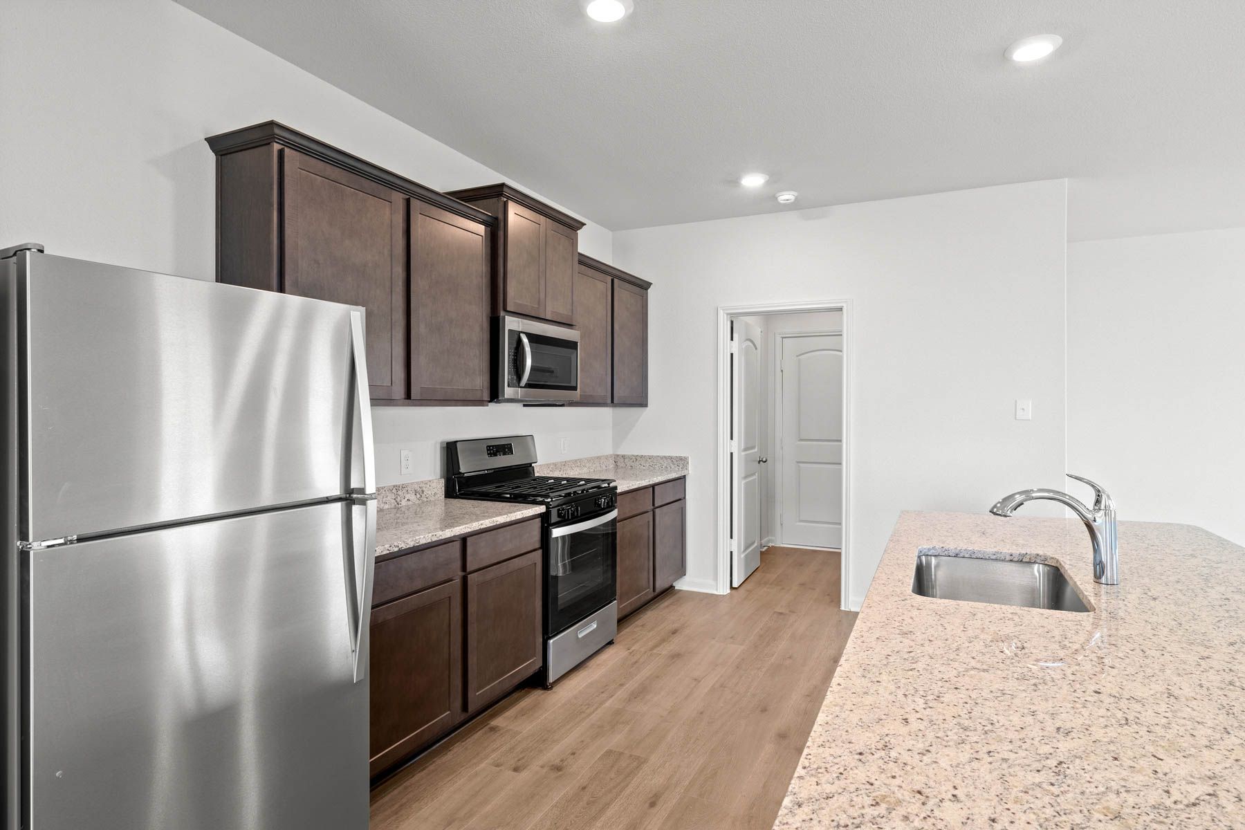 The beautiful kitchen has wonderful upgrades like granite countertops.