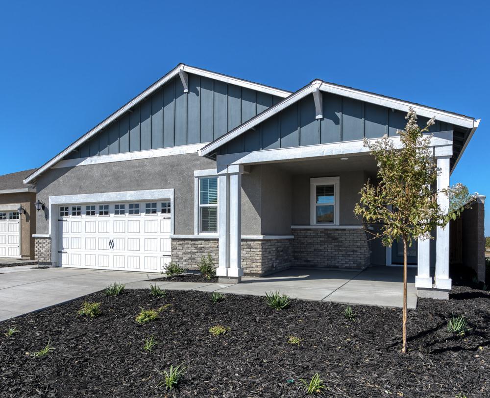 Beautiful brick detailing and large covered patio add to the elegance of the home