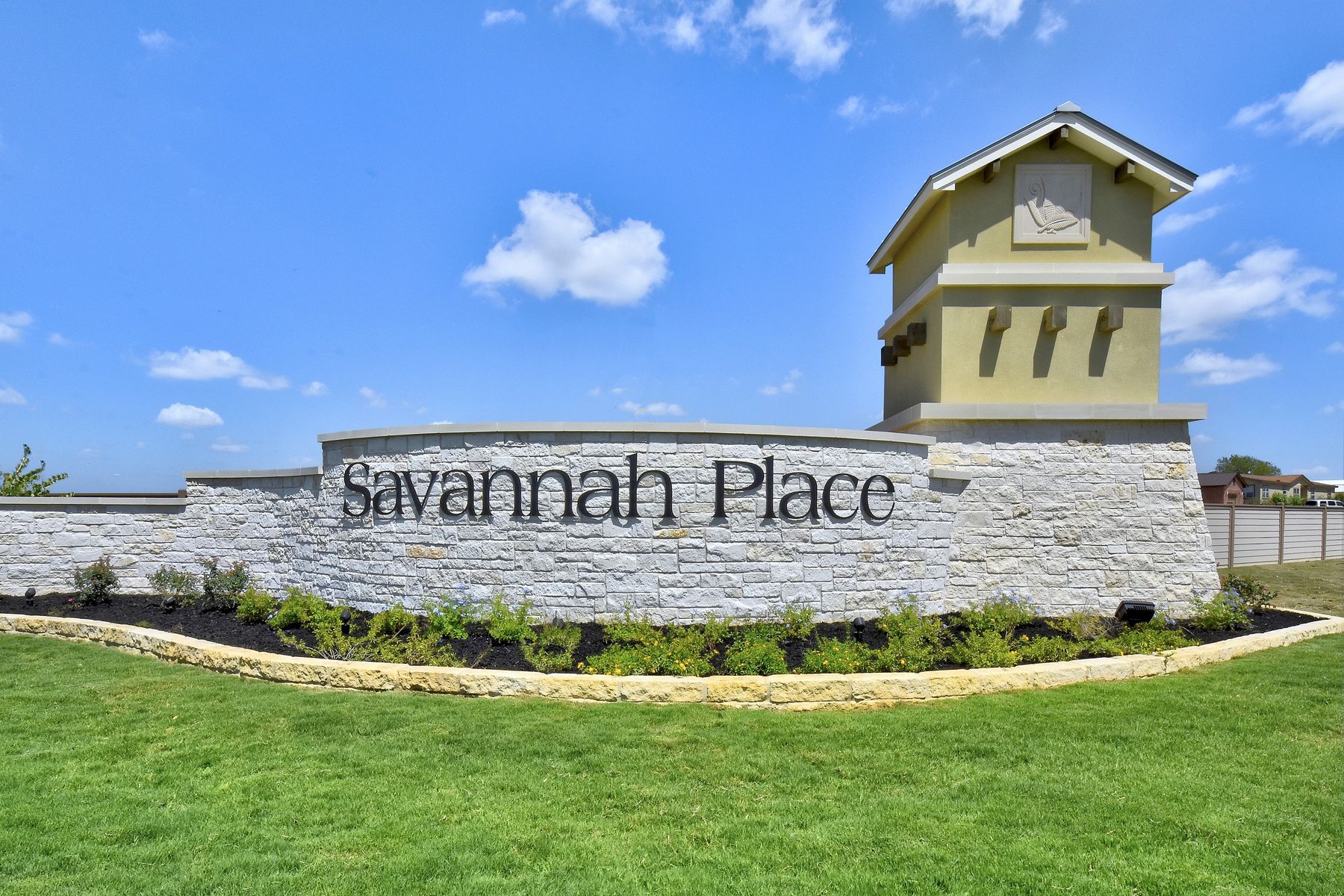 The gorgeous entry monument that greets you at Savannah Place.