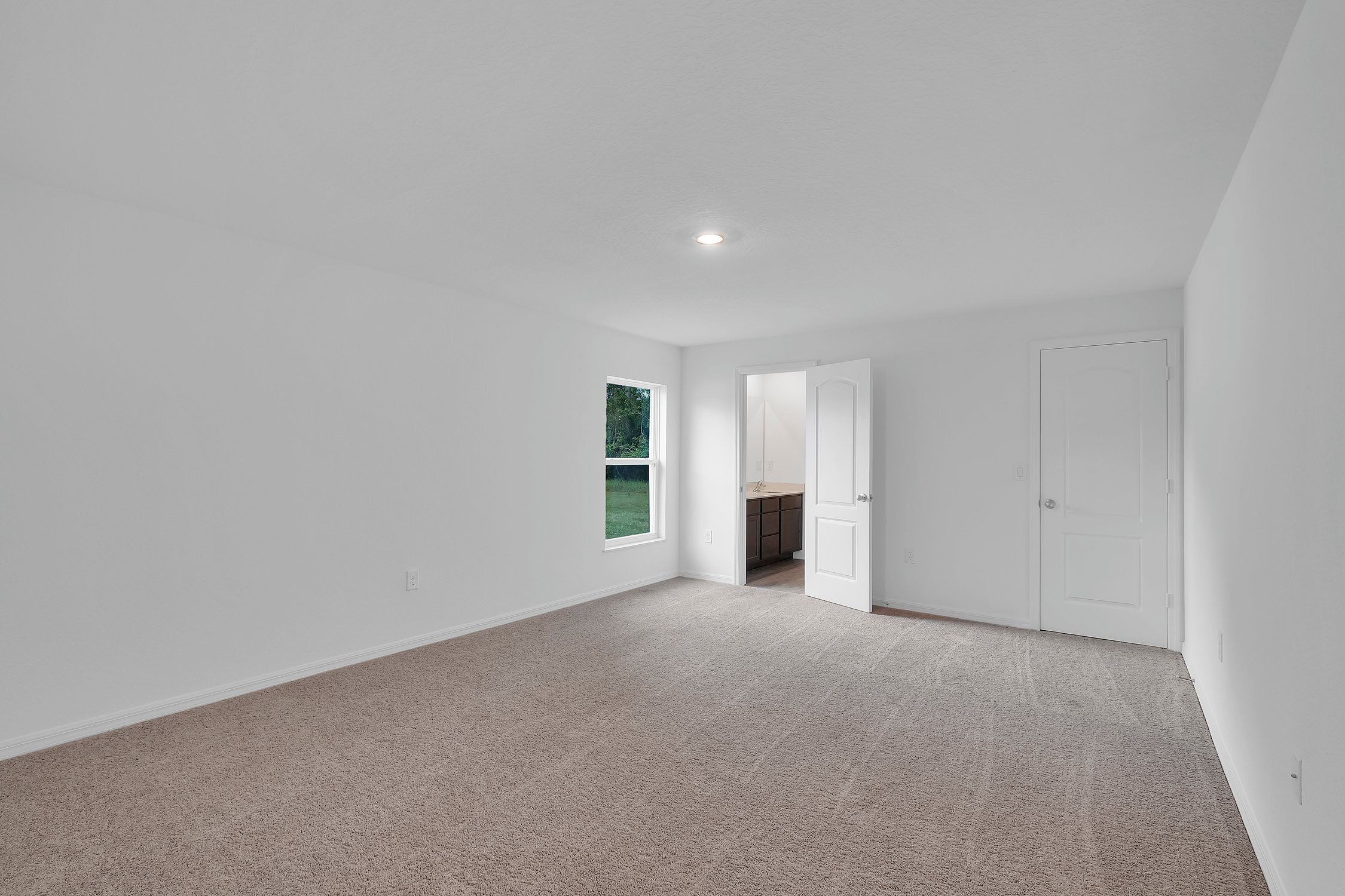 Spacious bedrooms and closets abound in this new home