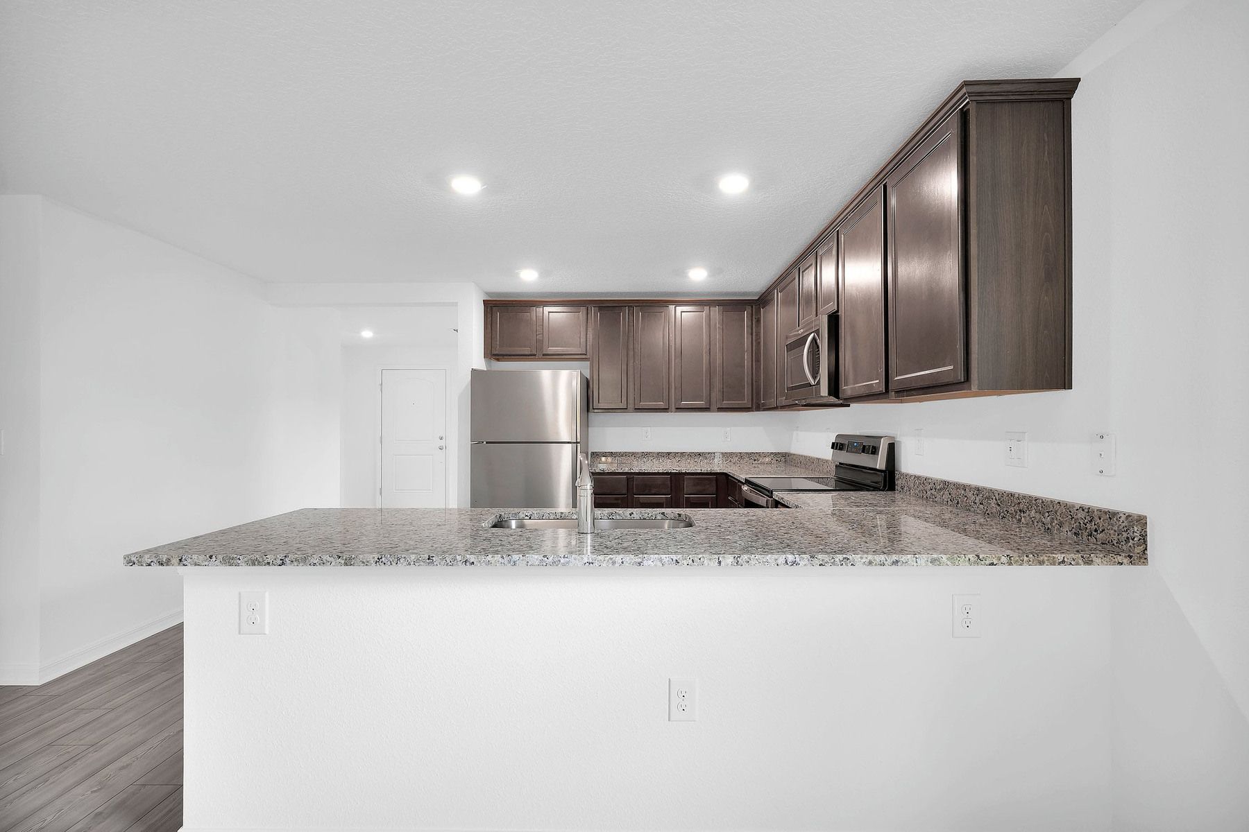 The open-concept kitchen overlooking the entertainment space is a fan favorite