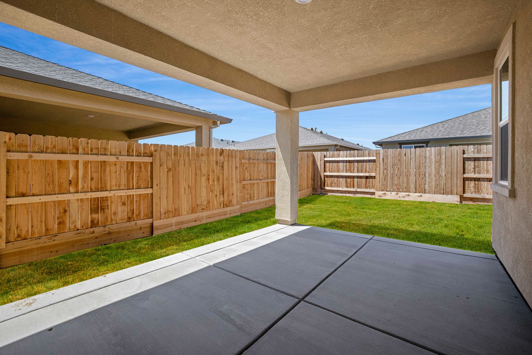 The covered back patio of the Lincoln plan is perfect for relaxing.
