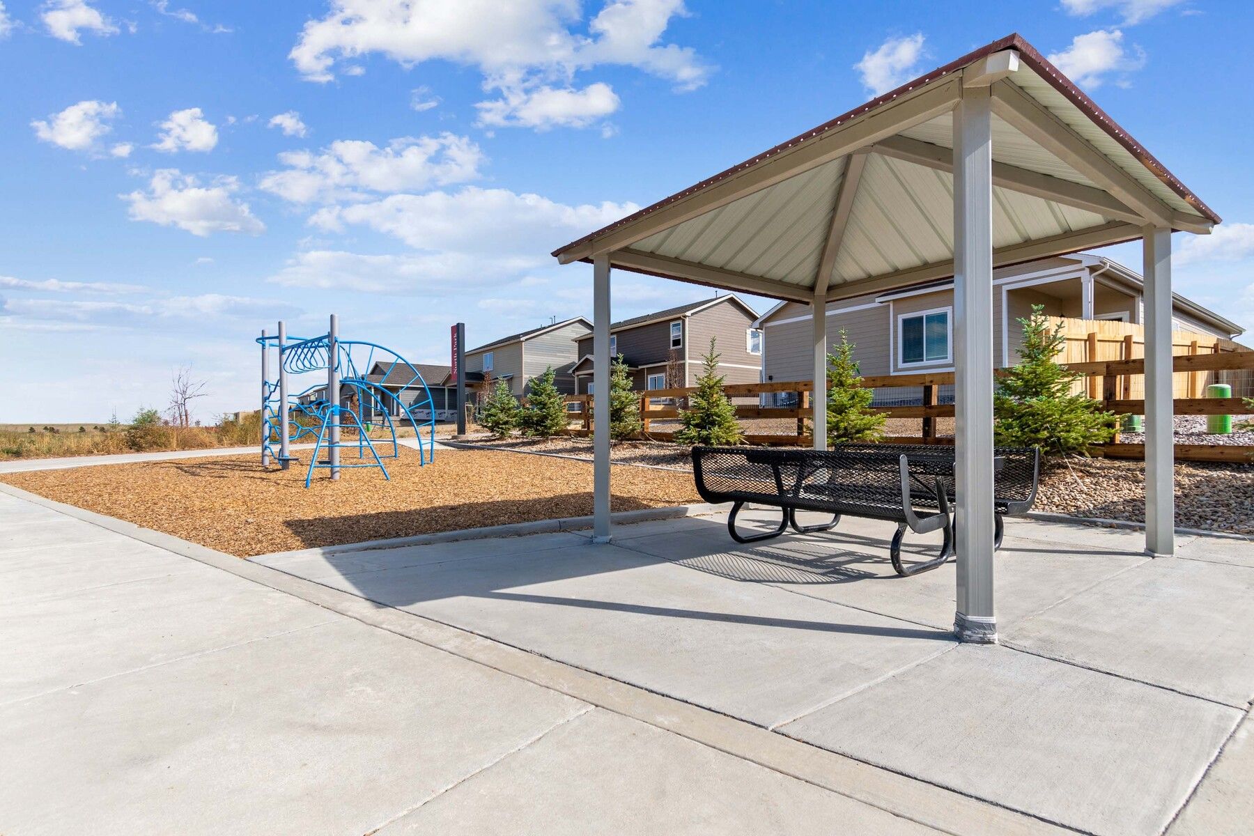 There is a community park with a small playground and some benches.