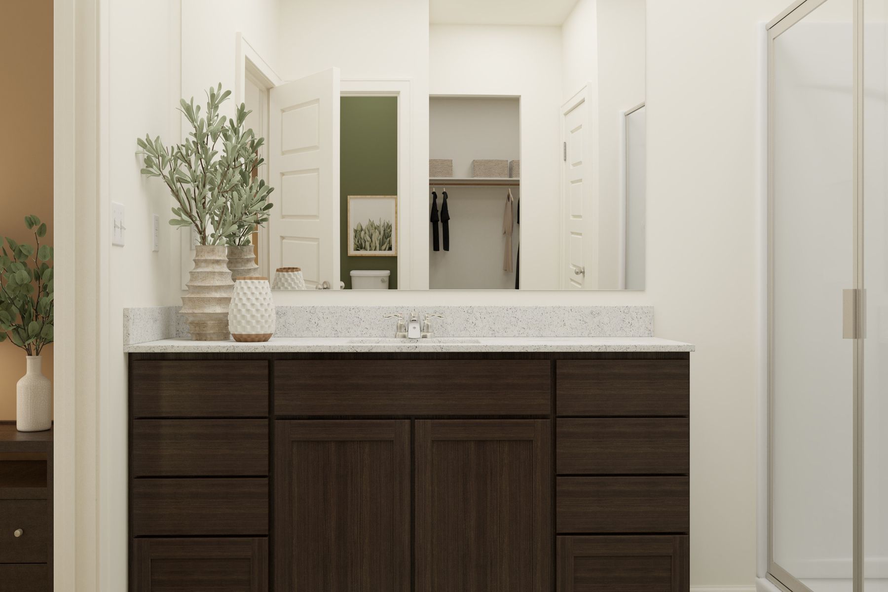 The master bathroom has a large vanity and a step in shower.