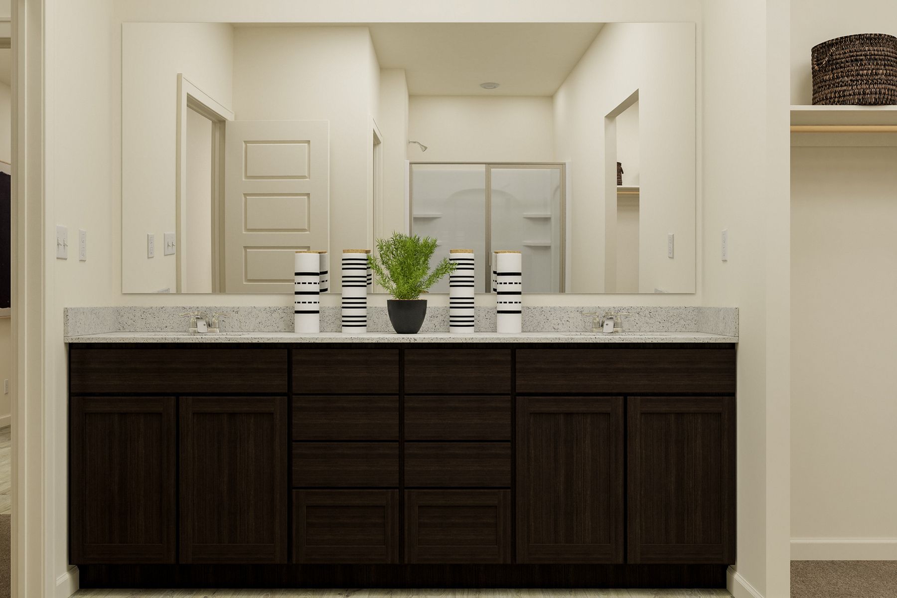 The master bathroom has a large vanity and a step in shower.