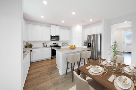 Staged kitchen with stainless steel appliances