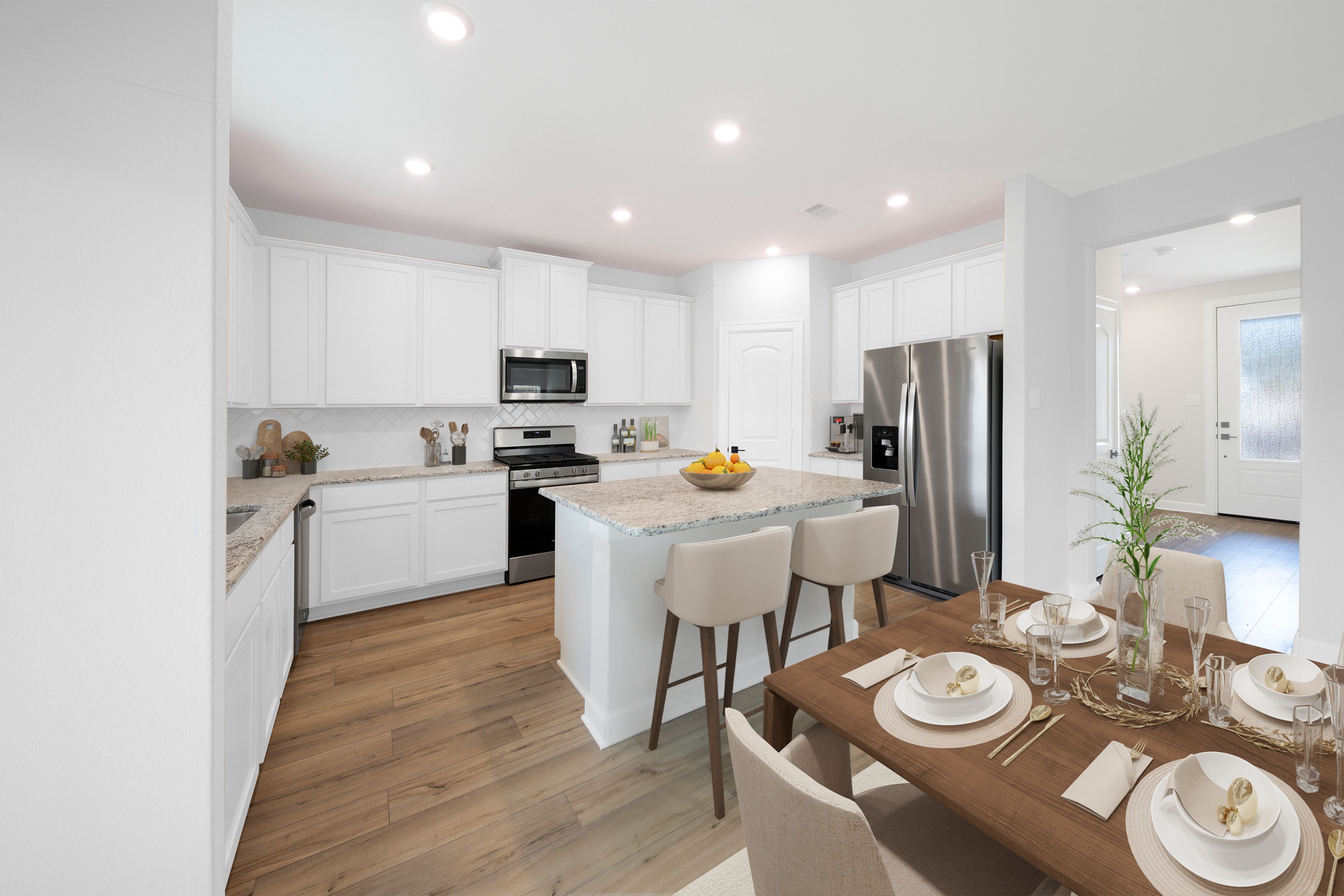 Staged kitchen with stainless steel appliances