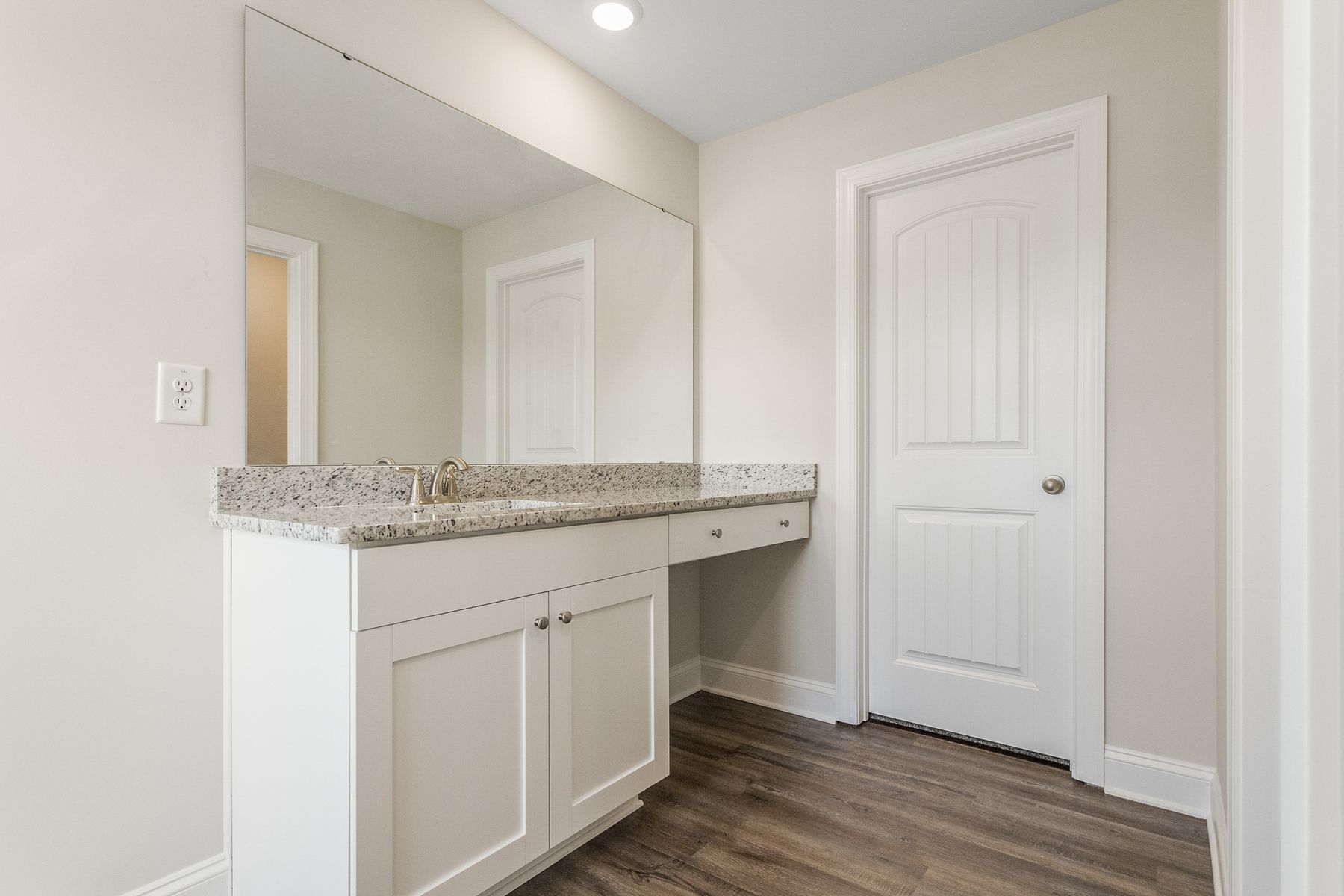 Enjoy a large vanity and walk-in shower