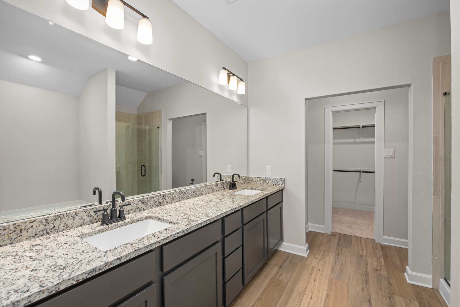 The master bathroom has a large vanity and step in shower!