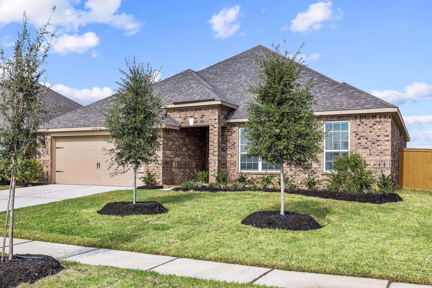 The Leland is a single story home with brick.