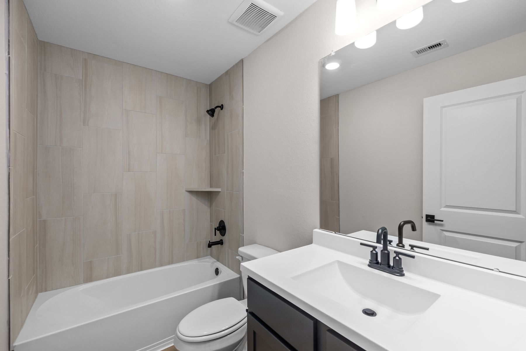 The secondary bathrooms have tub/shower combos.
