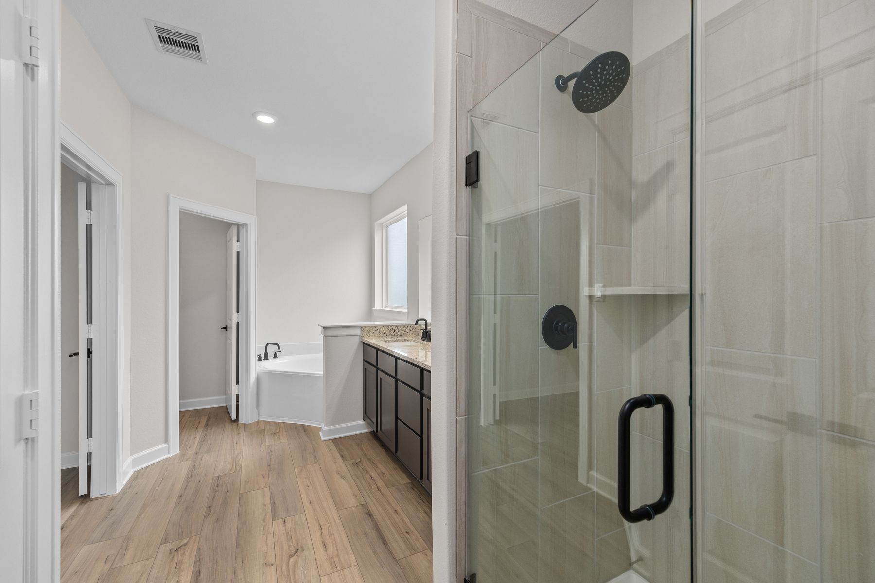 The master bathroom also has a large step in shower.