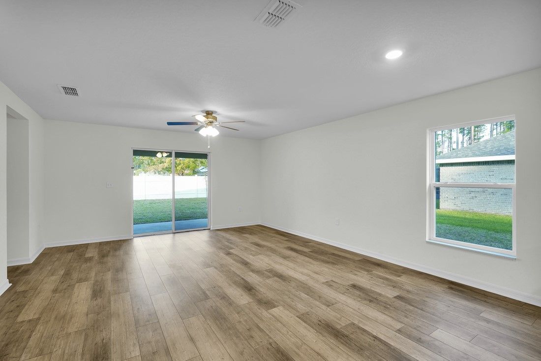 The family room has sliding glass doors that lead to the back patio
