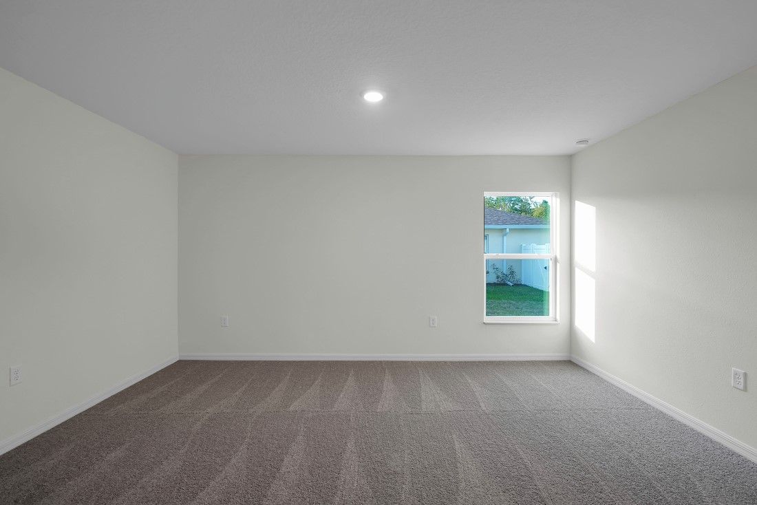 The spacious master bedroom with attached bathroom and walk-in closet