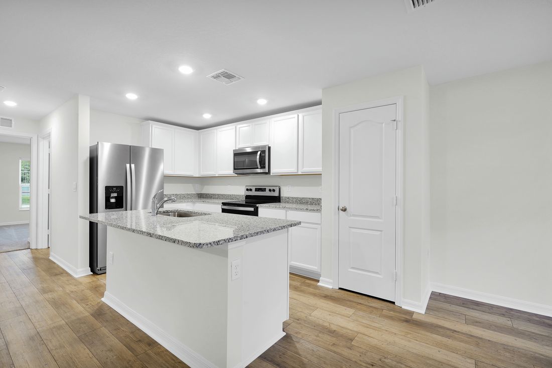 The kitchen of the Brickell has a large island, perfect for hosting