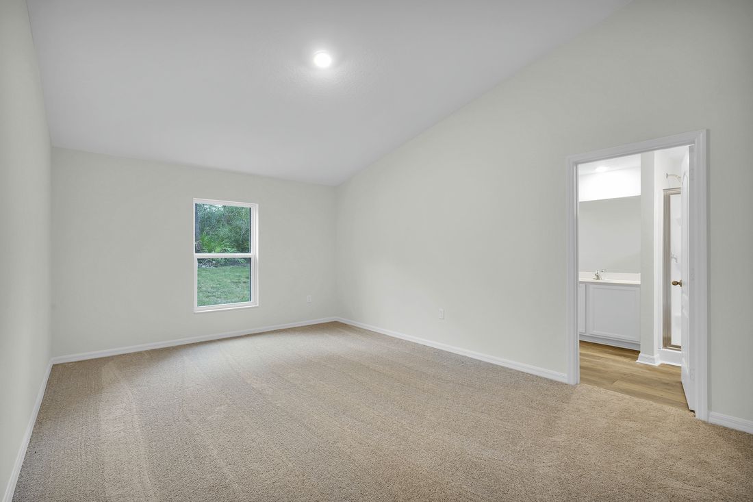 The master bedroom is spacious and has an attached bathroom